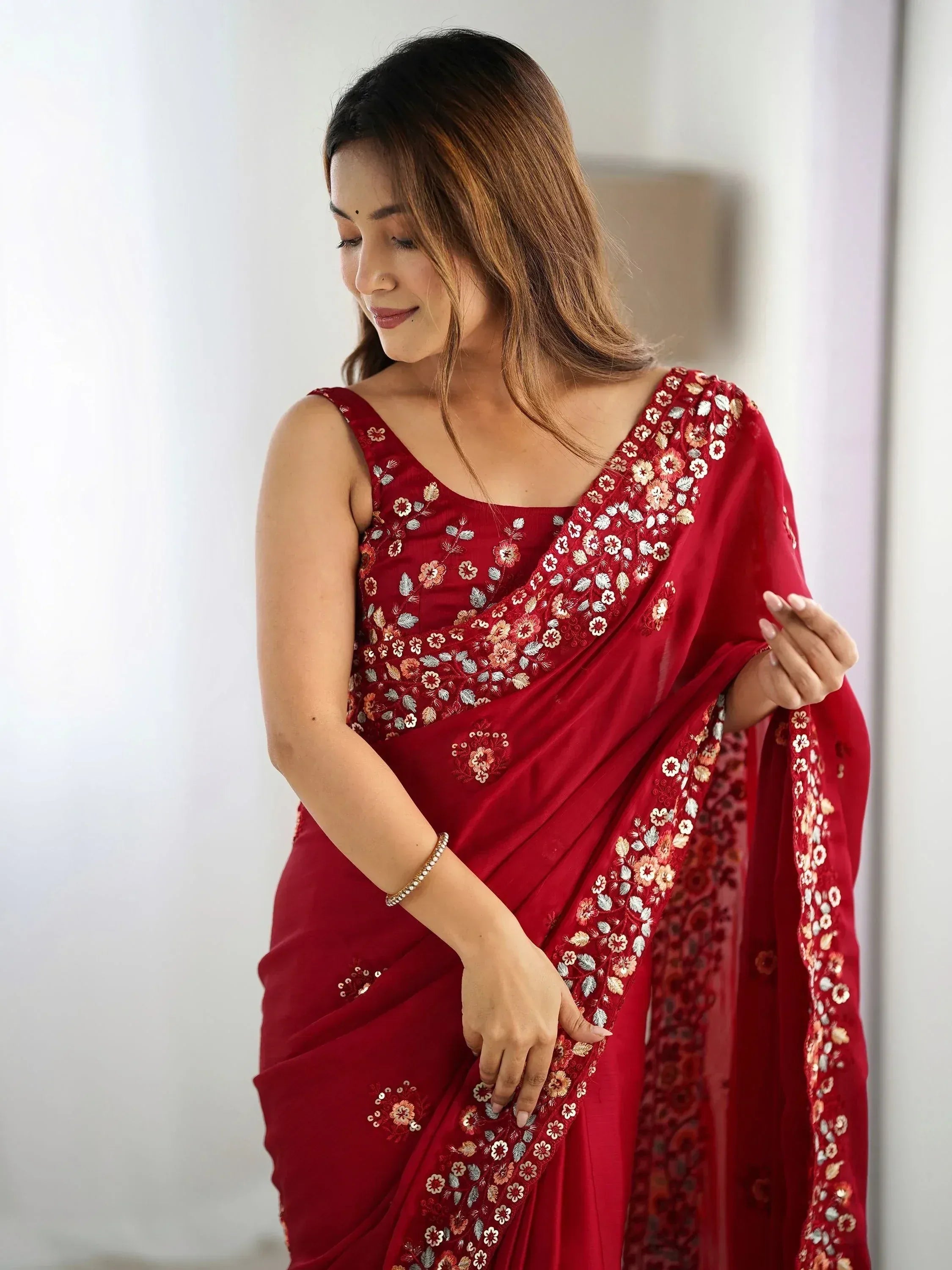 Red embroidered saree with floral design, perfect for Indian ethnic wear occasions