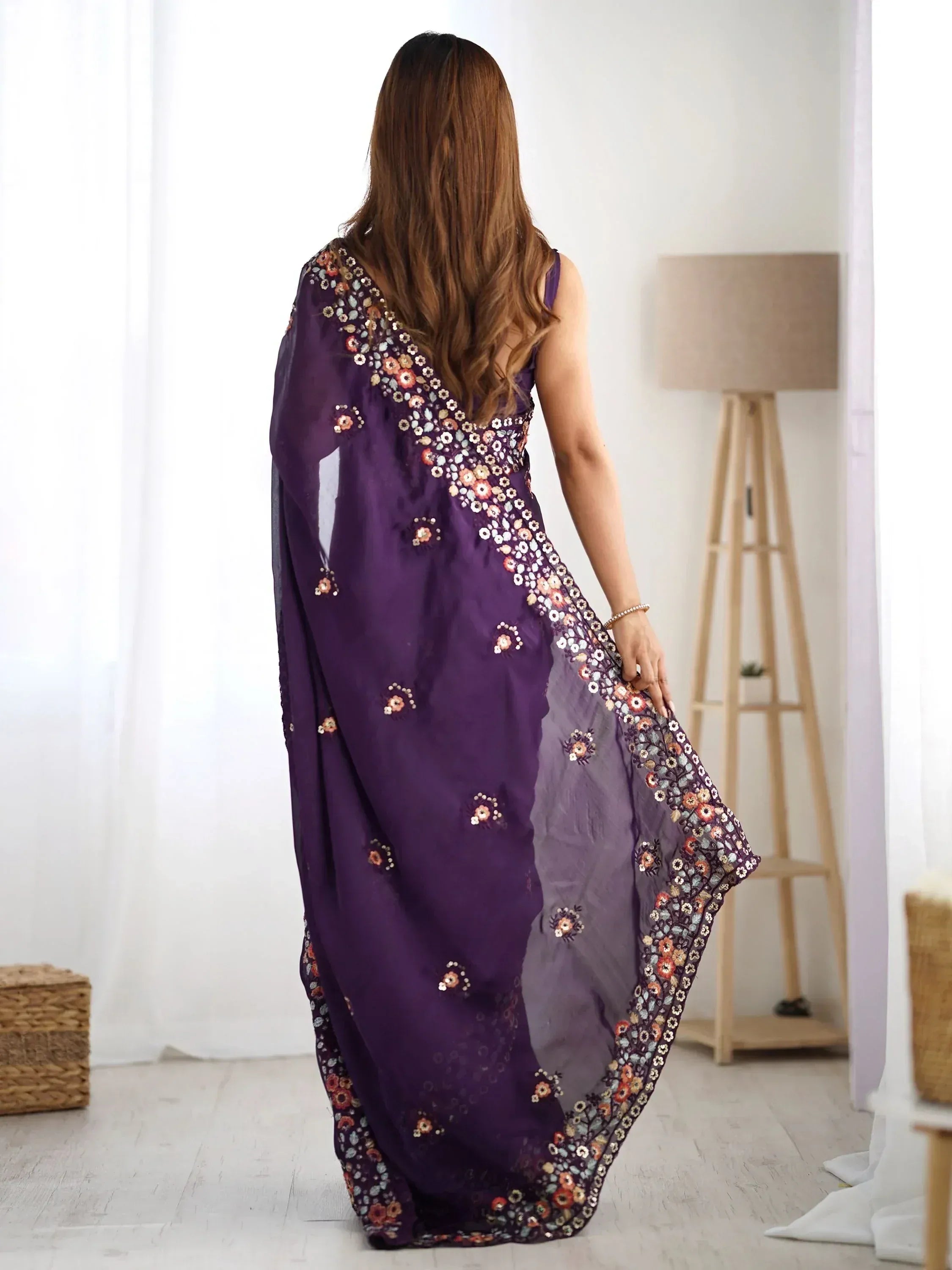 Purple floral embroidered ethnic gown with sheer dupatta, perfect for Indian occasions and parties.