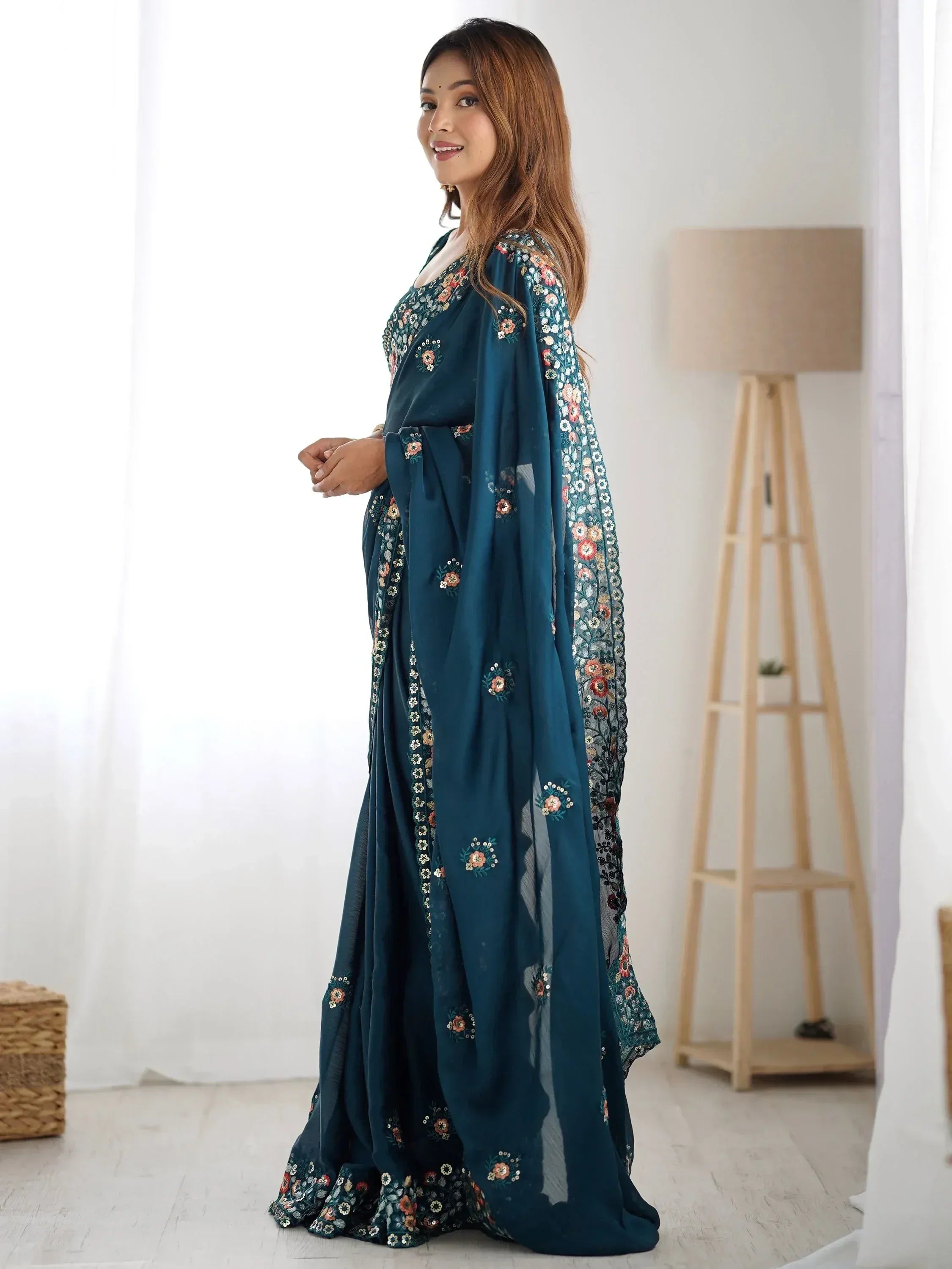 Teal floral embroidered ethnic gown with sheer sleeves, perfect for Indian occasions