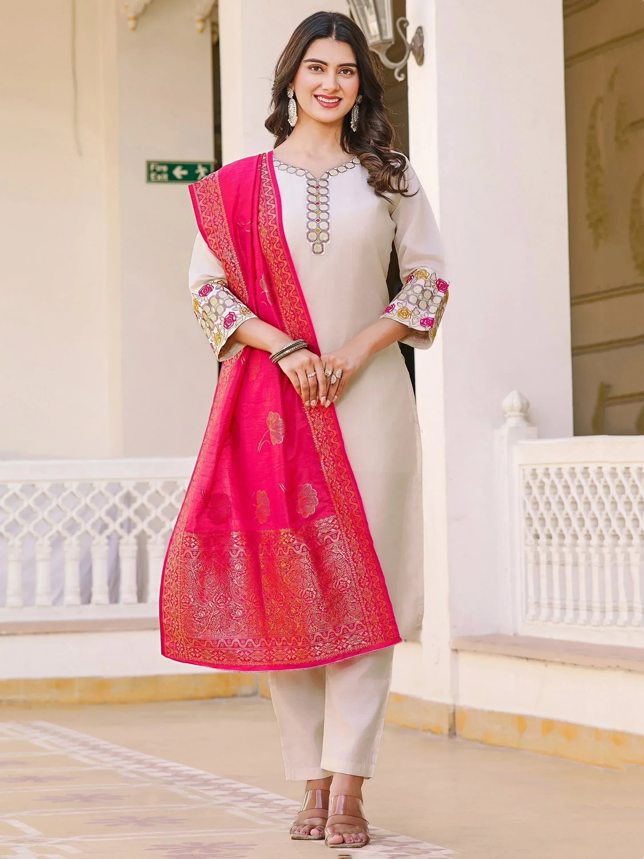 Woman in elegant white kurta with pink embroidered dupatta, Indian ethnic wear for festive occasions