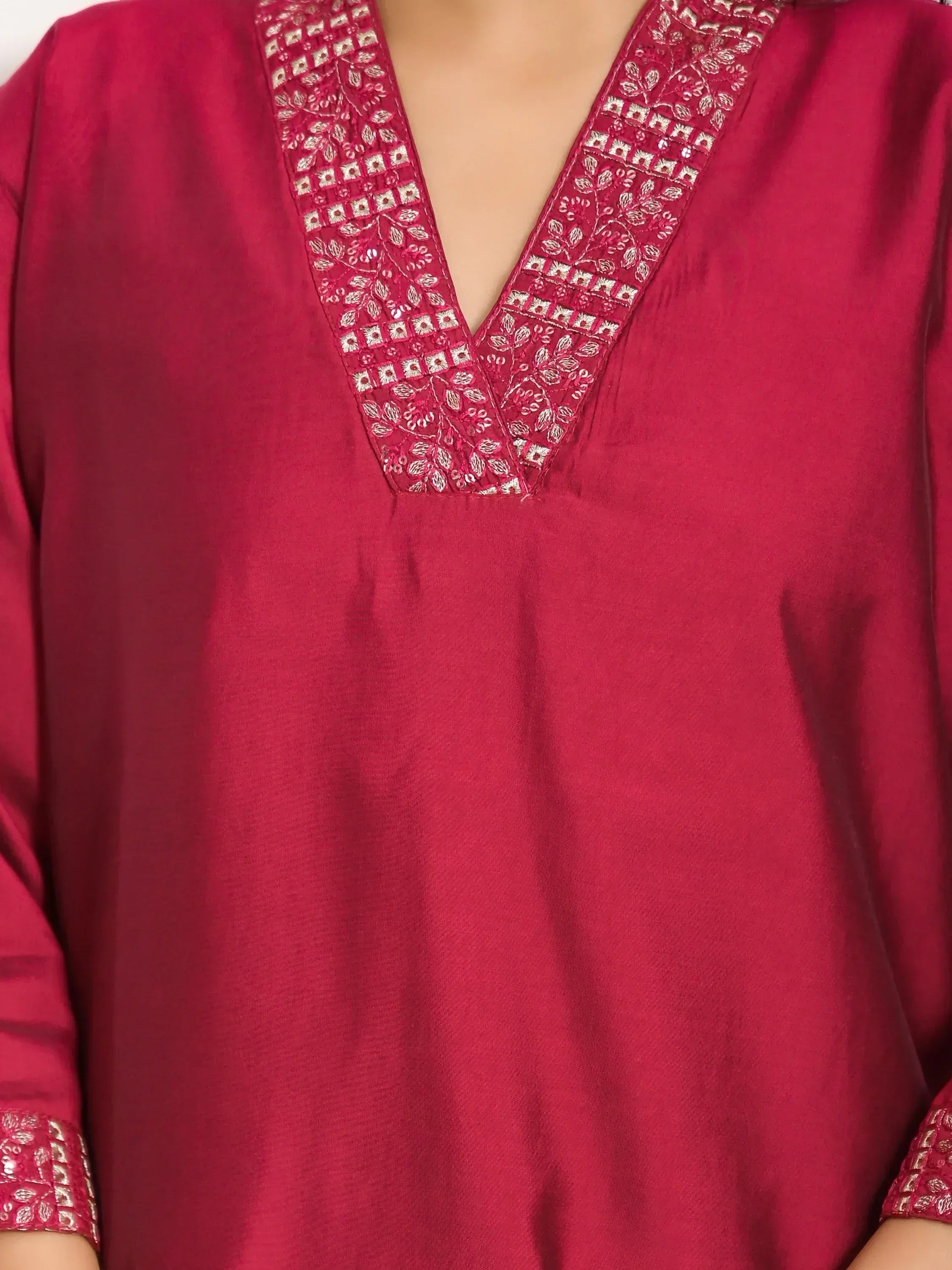 Deep red ethnic kurta with intricate silver embroidery on V-neck and cuffs, perfect for Indian festive wear.
