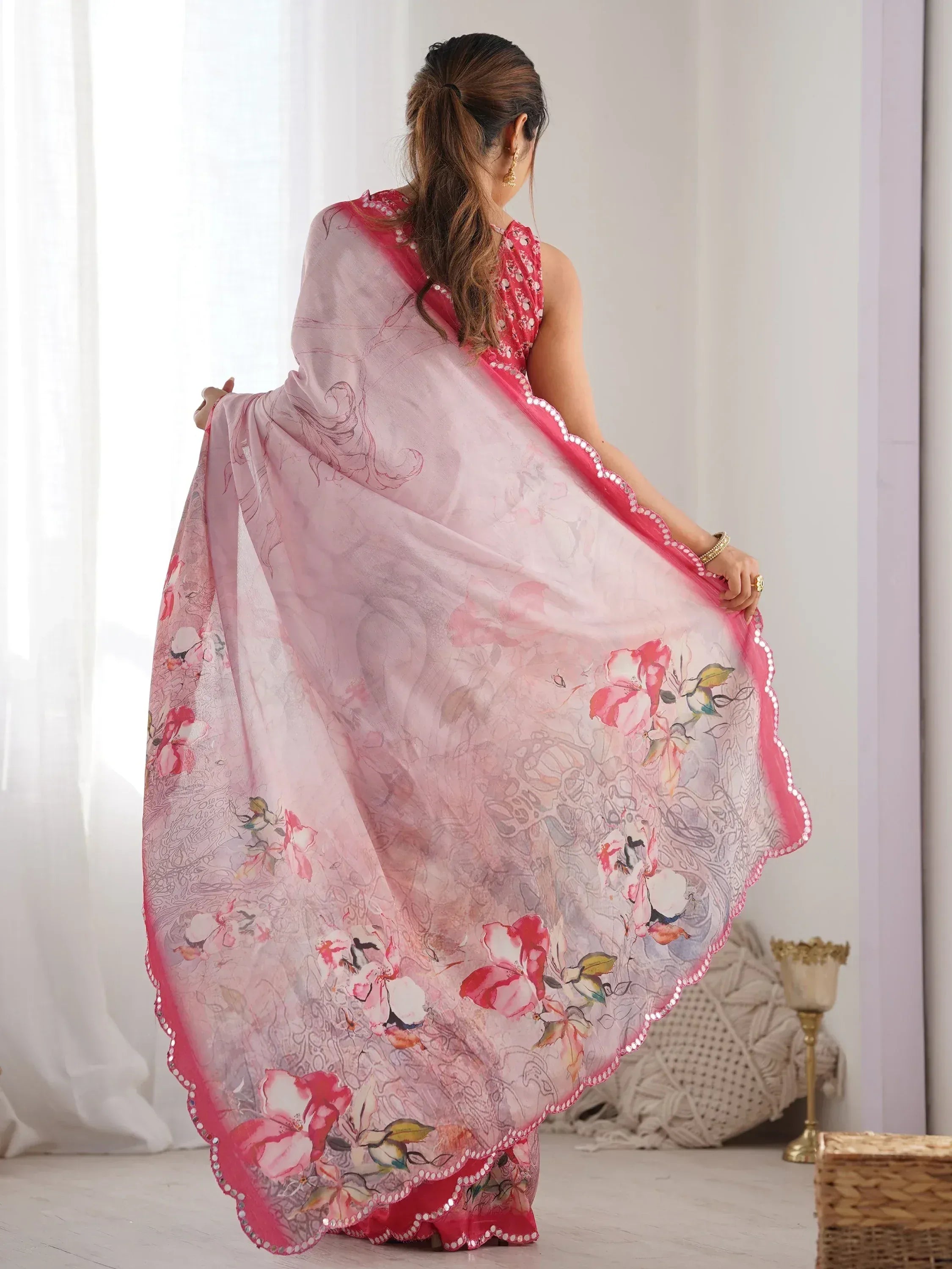 Pink floral printed saree with sequin border, styled with ethnic blouse for Indian wear