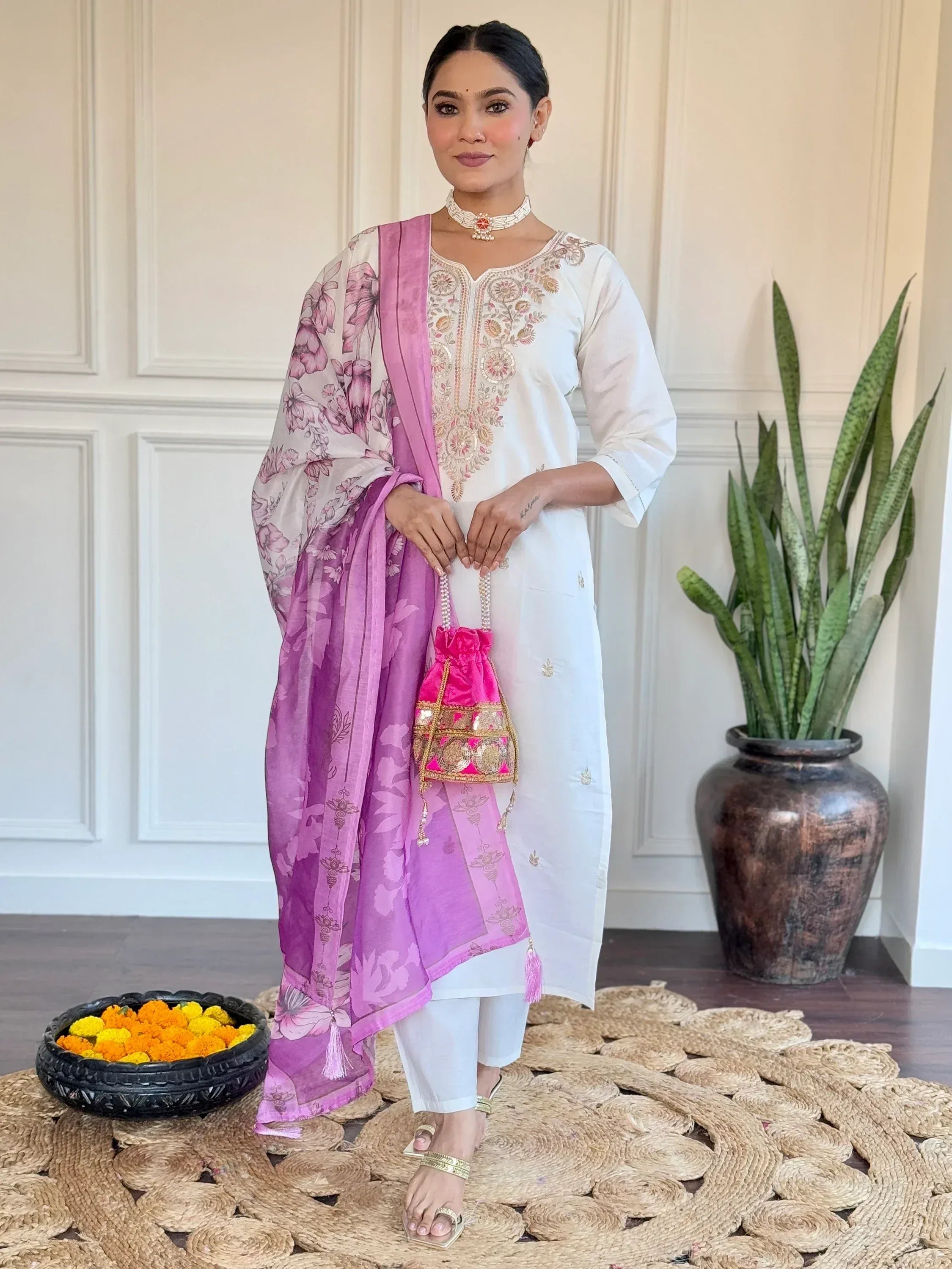 White embroidered kurta with pink floral dupatta, ethnic wear for women, paired with potli bag and choker