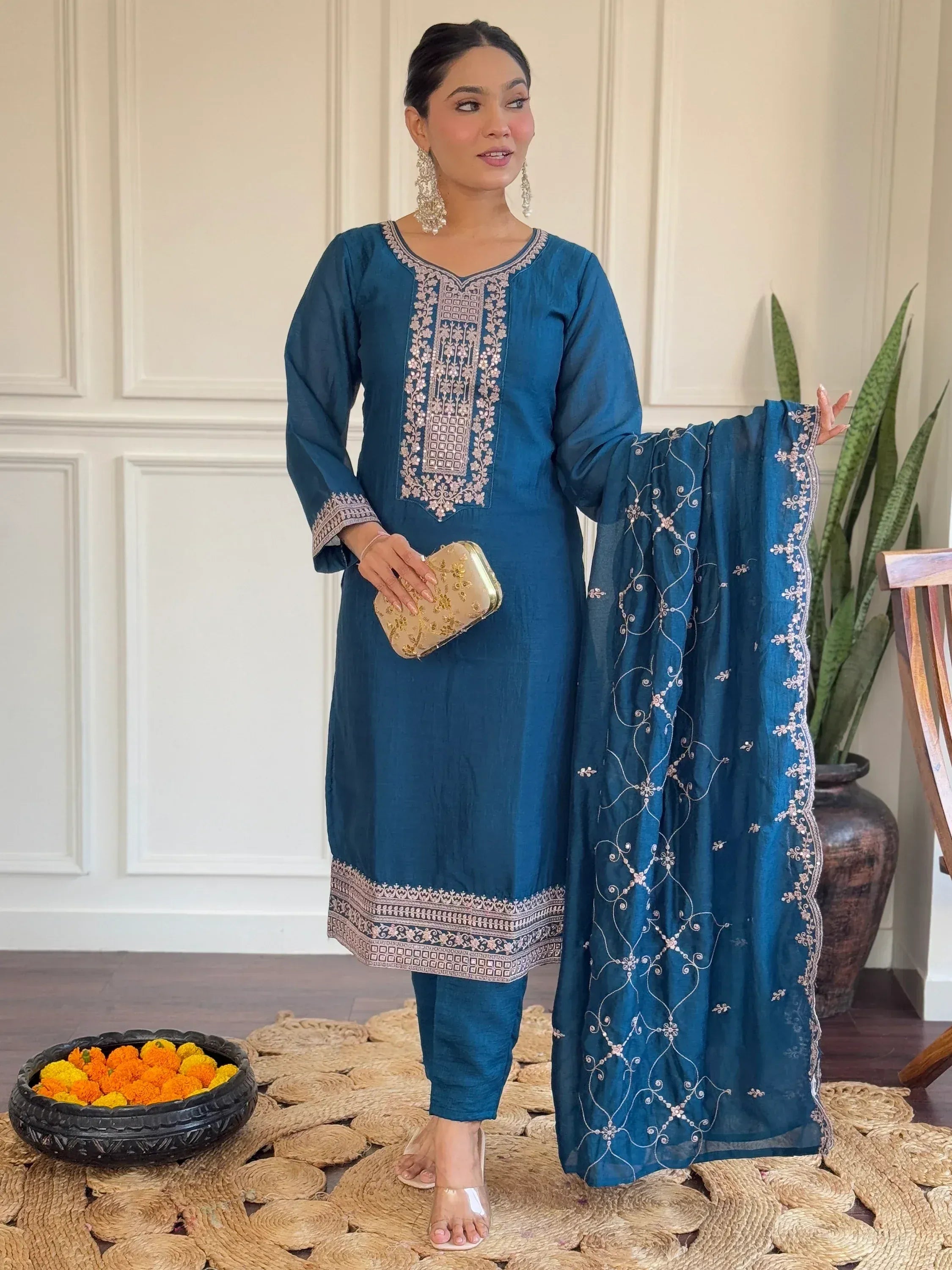 Teal embroidered salwar kameez with matching dupatta, perfect for ethnic occasions
