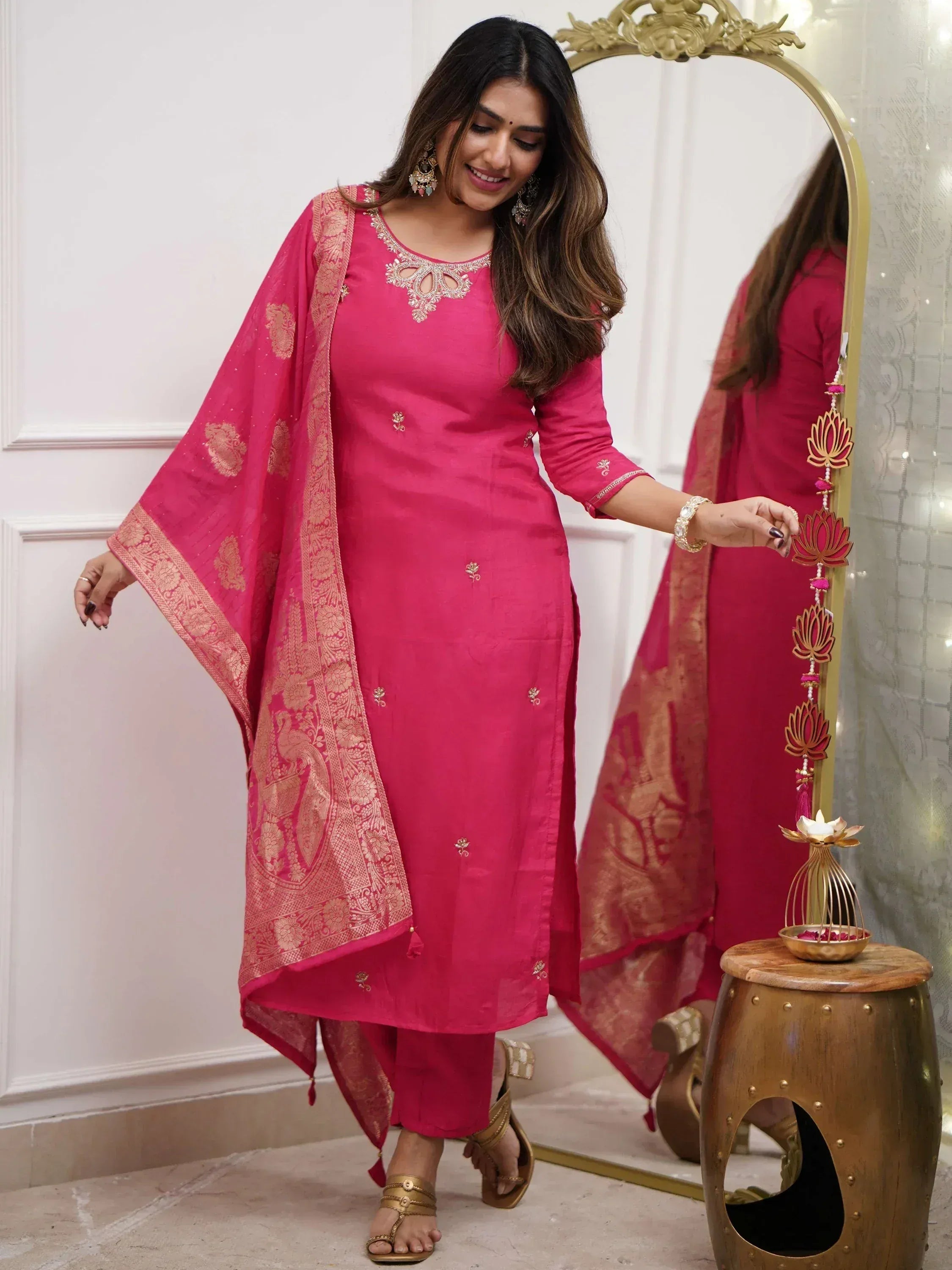 Pink ethnic salwar kameez with gold embroidery and matching dupatta, perfect for festive occasions