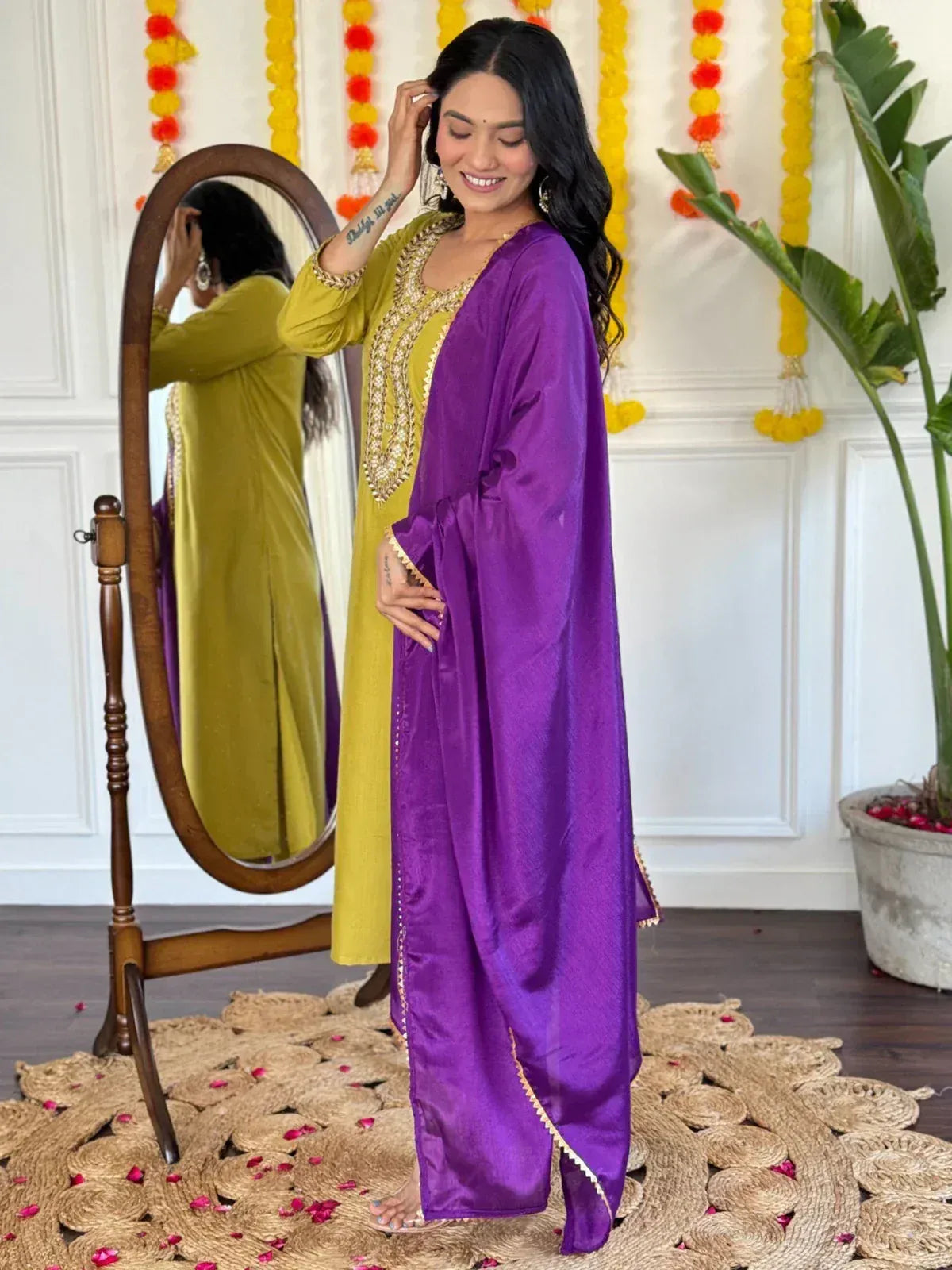 Woman in yellow embroidered kurta with purple dupatta, festive Indian ethnic wear