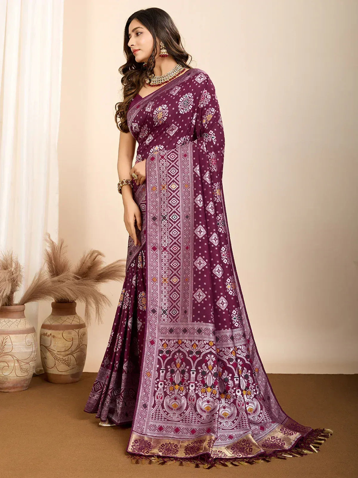 Elegant purple ethnic saree with intricate geometric and floral patterns, perfect for traditional occasions.