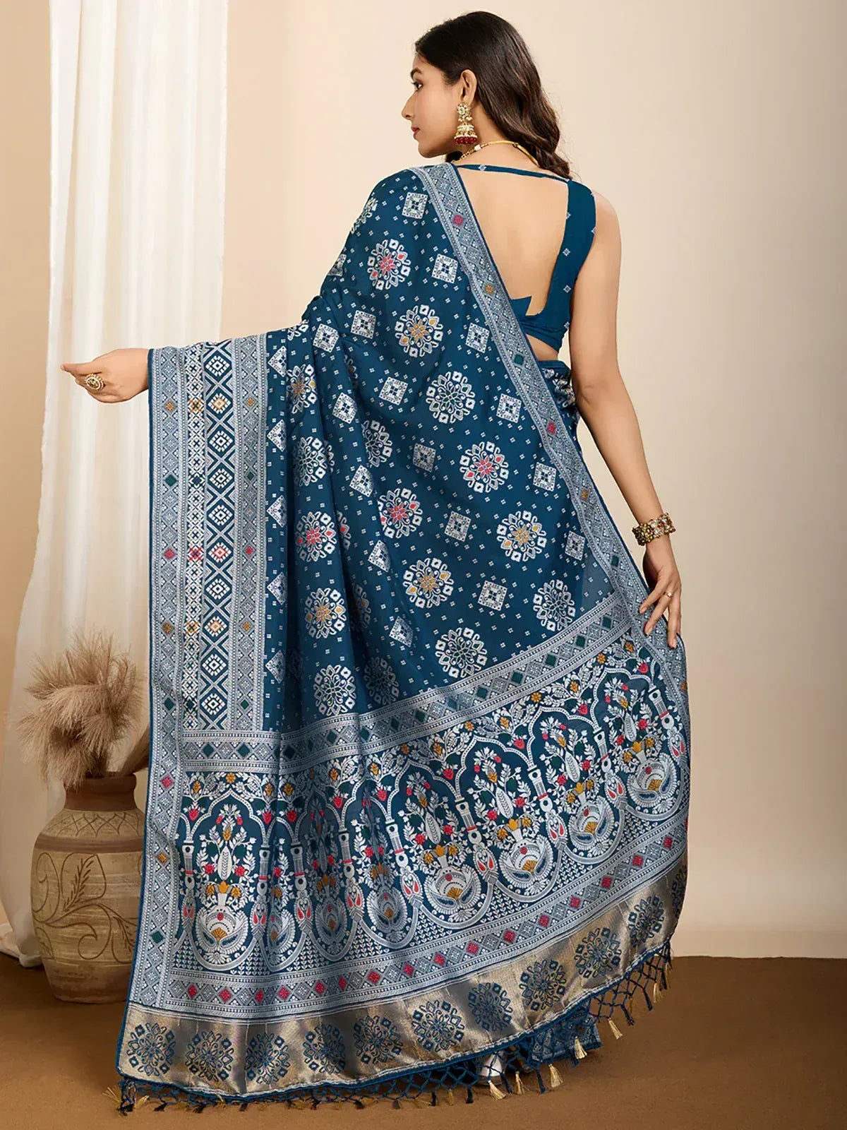 Blue printed saree with intricate floral and geometric patterns, paired with a matching blouse