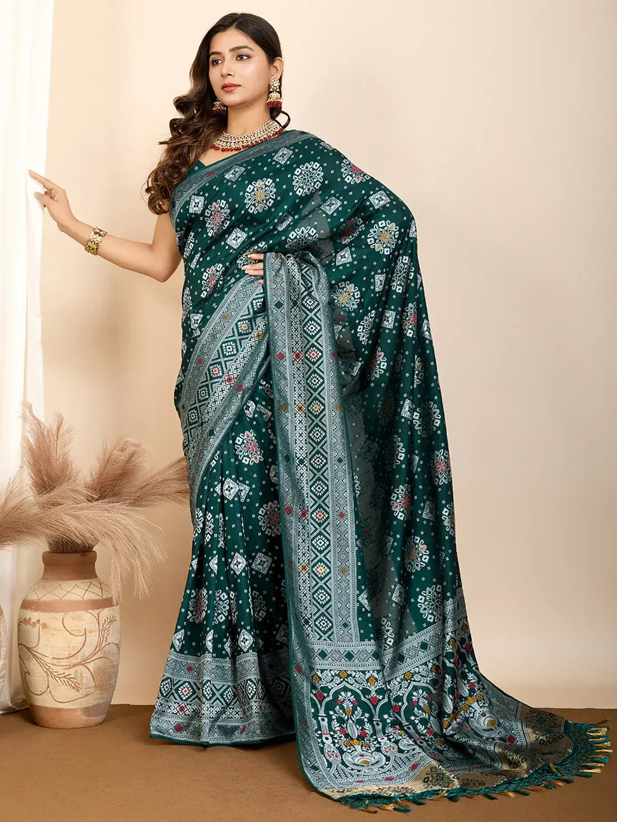 Elegant green printed saree with intricate geometric and floral designs, perfect for ethnic occasions.