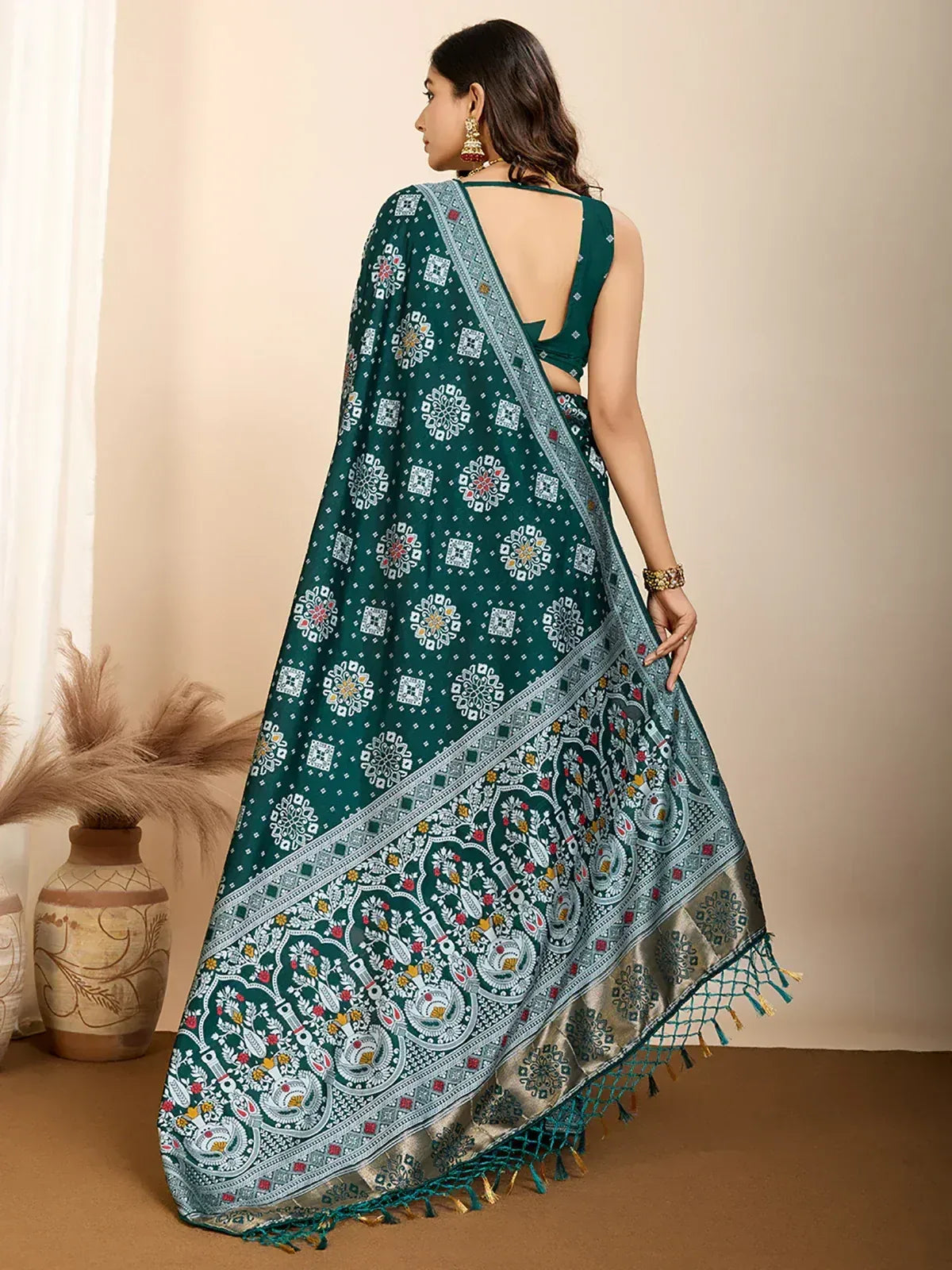 Elegant green printed saree with intricate paisley and geometric designs, perfect for ethnic occasions.