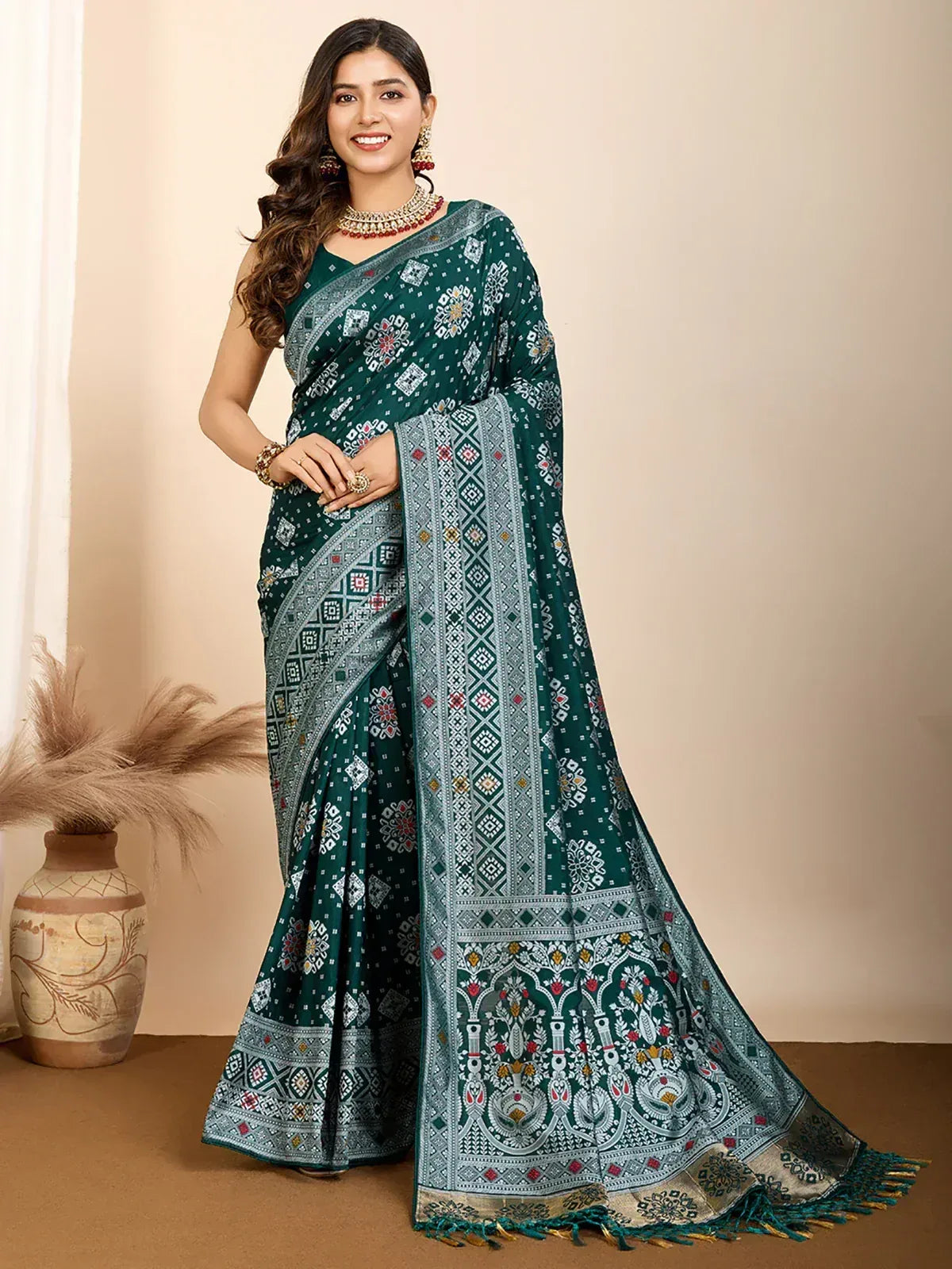 Emerald green printed saree with intricate geometric and floral motifs, perfect for ethnic occasions