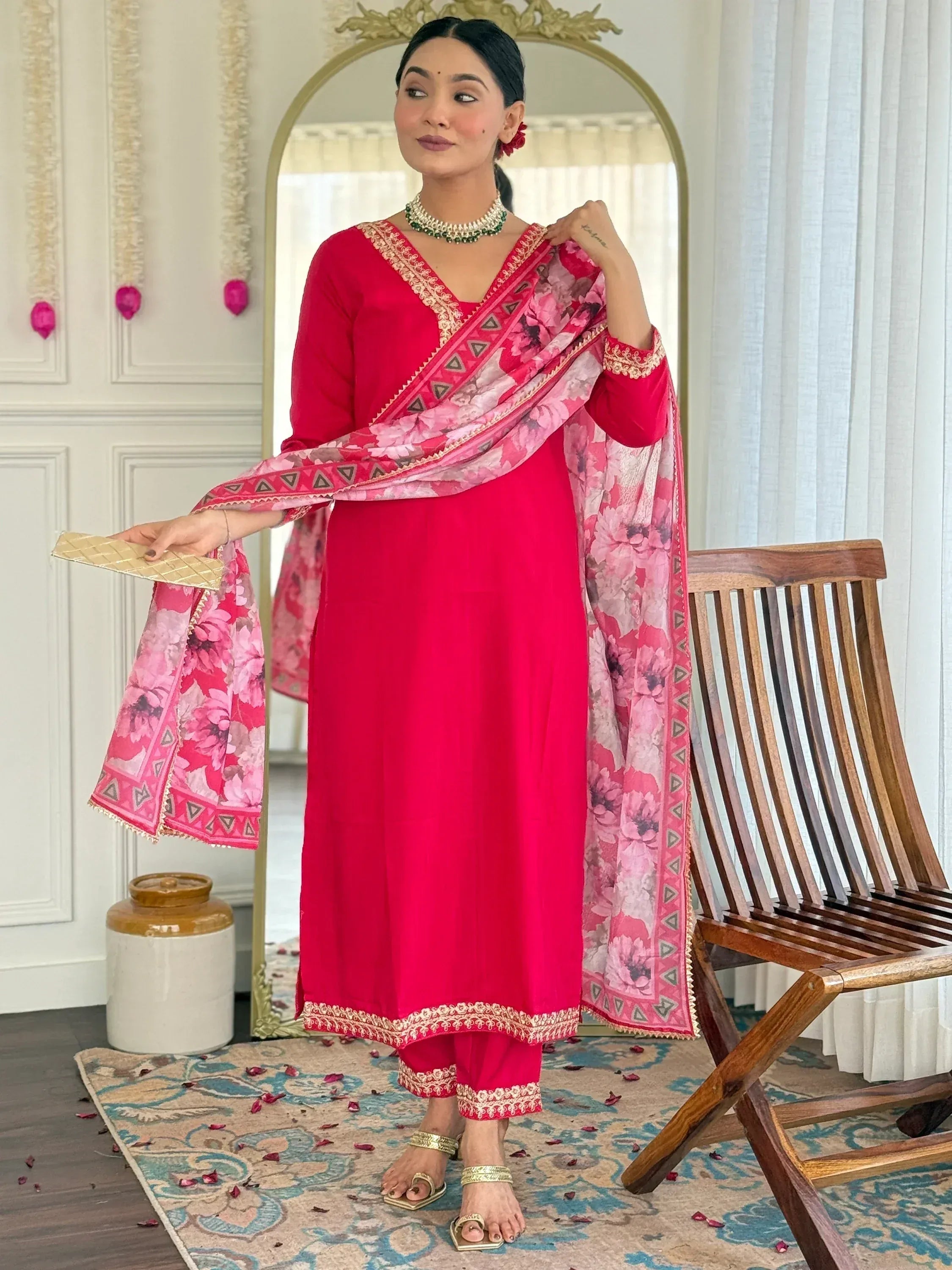 Vibrant pink salwar kameez with floral dupatta, perfect for Indian ethnic occasions and festive wear.