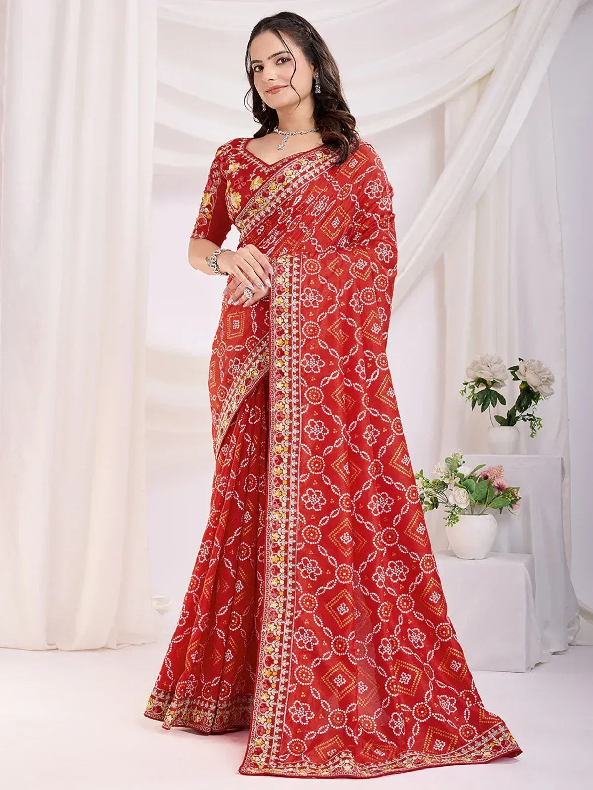 Red printed saree with floral and geometric embroidery, perfect for Indian ethnic occasions
