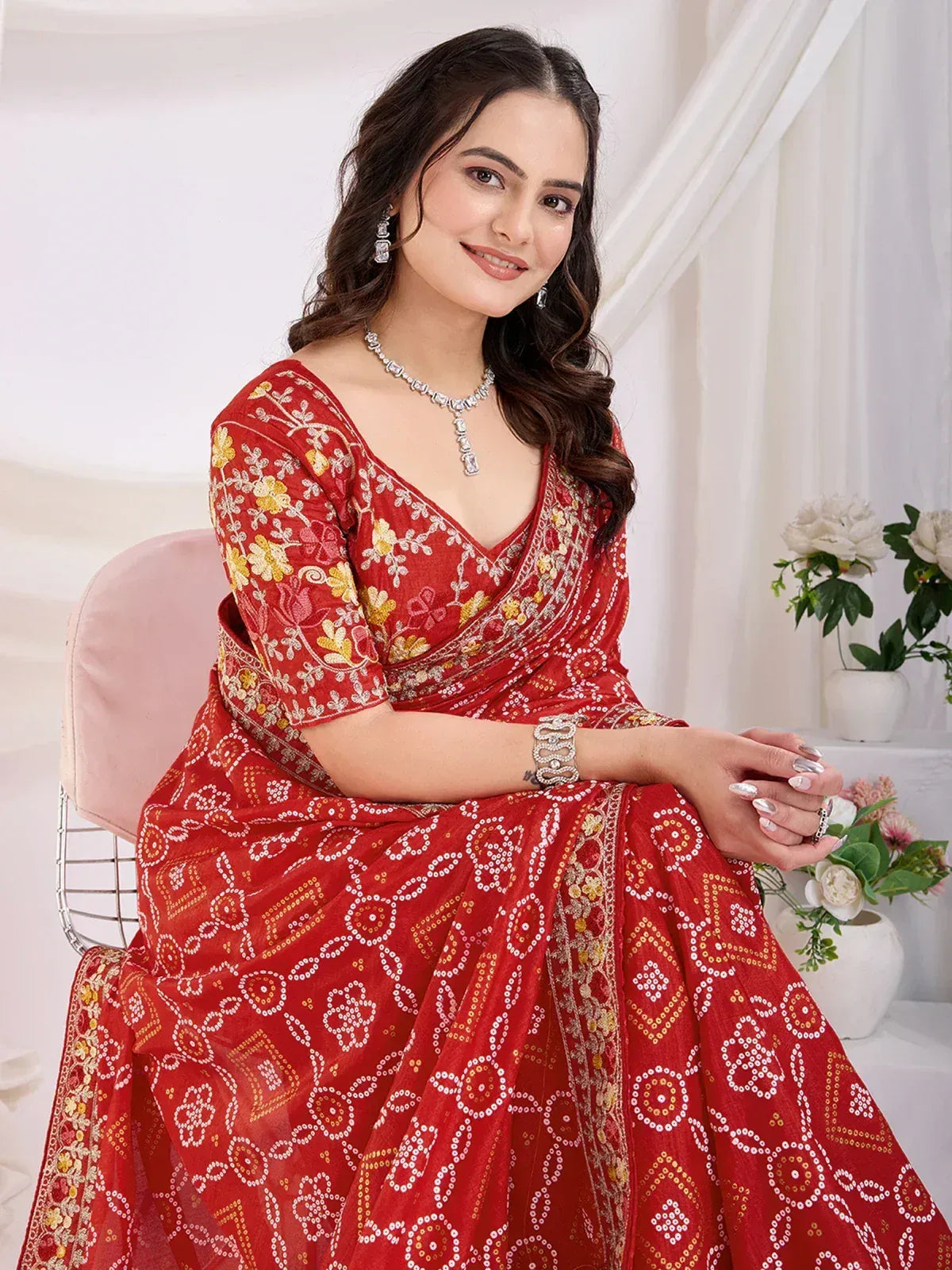 Red embroidered saree with floral and geometric patterns, perfect for Indian ethnic wear occasions