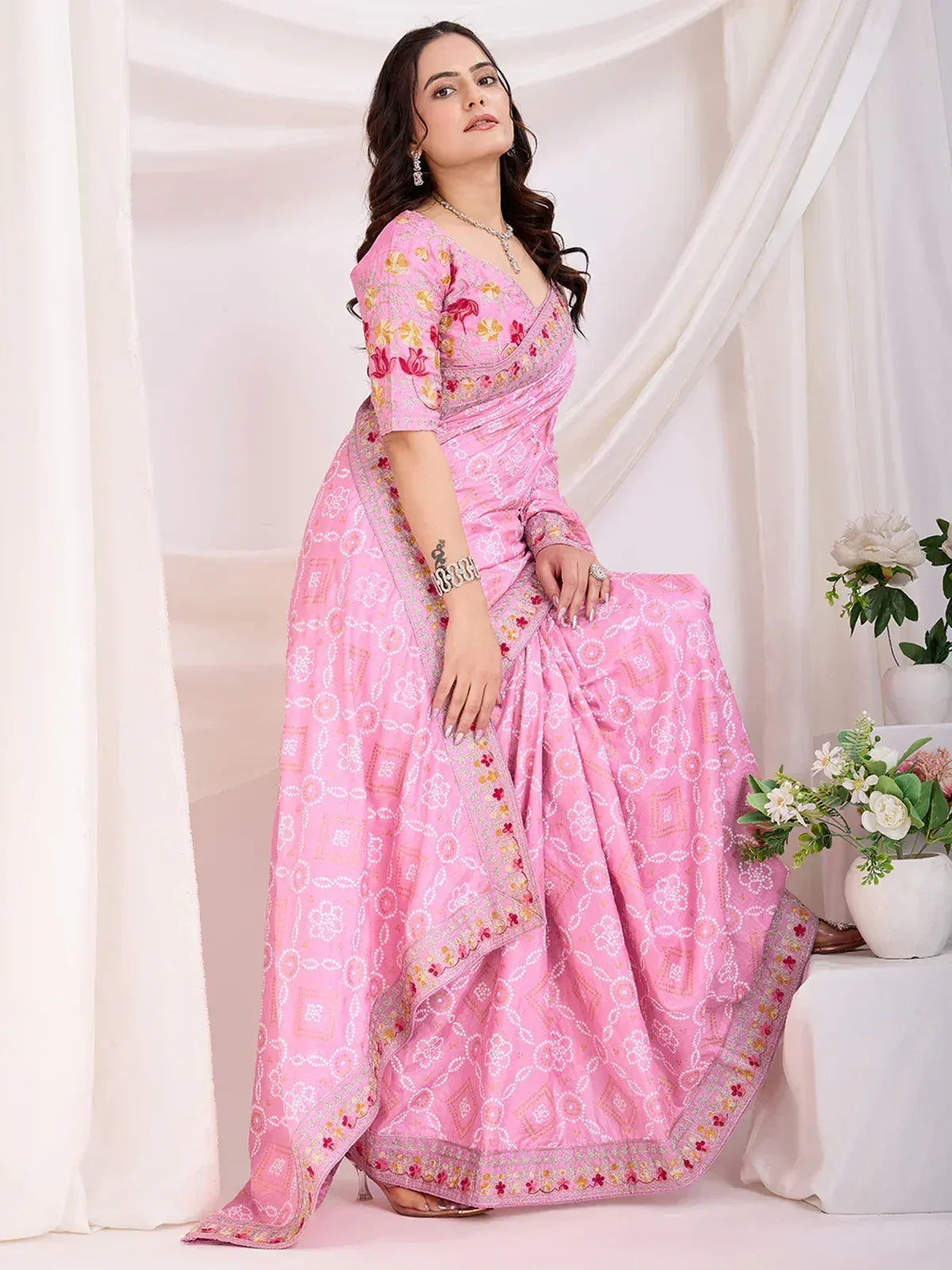 Pink floral print saree with embroidered border, perfect for Indian ethnic occasions