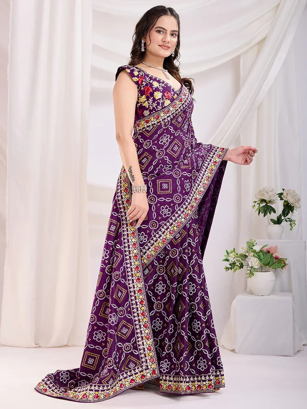 Purple embroidered saree with floral and geometric patterns, perfect for Indian ethnic wear occasions