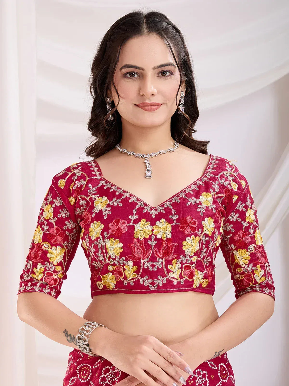 Red floral embroidered lehenga choli blouse with V-neck and 3/4 sleeves, perfect for Indian ethnic wear