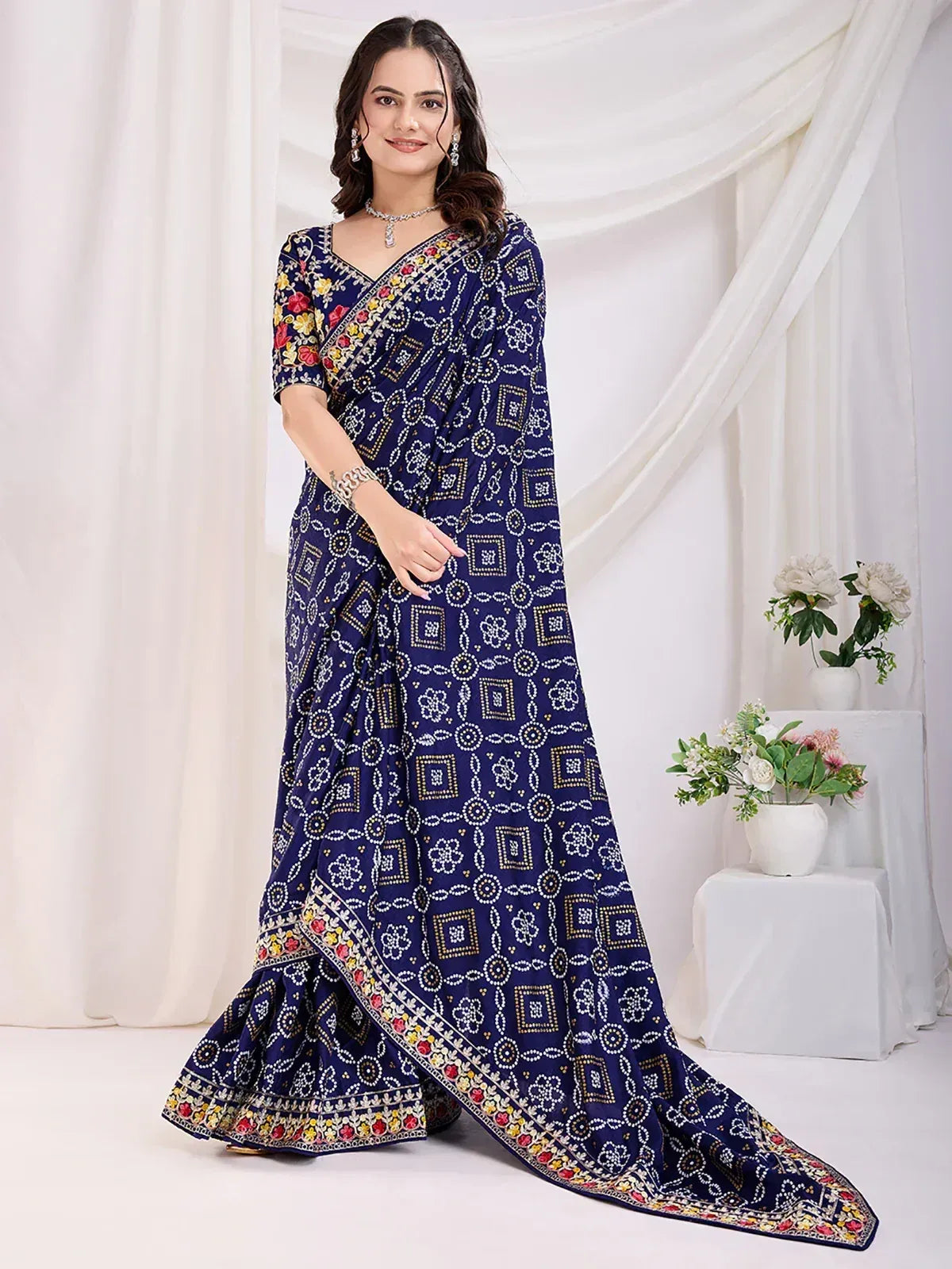 Navy blue printed saree with floral and geometric patterns, perfect for ethnic occasions