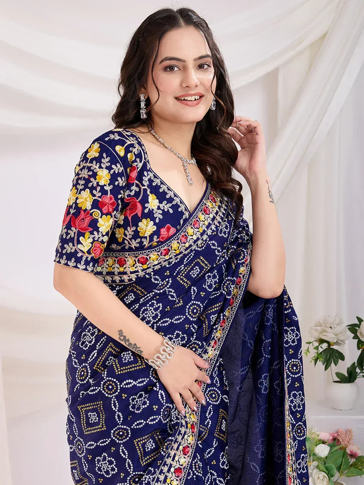 Blue embroidered saree with floral and geometric patterns, perfect for Indian ethnic wear occasions