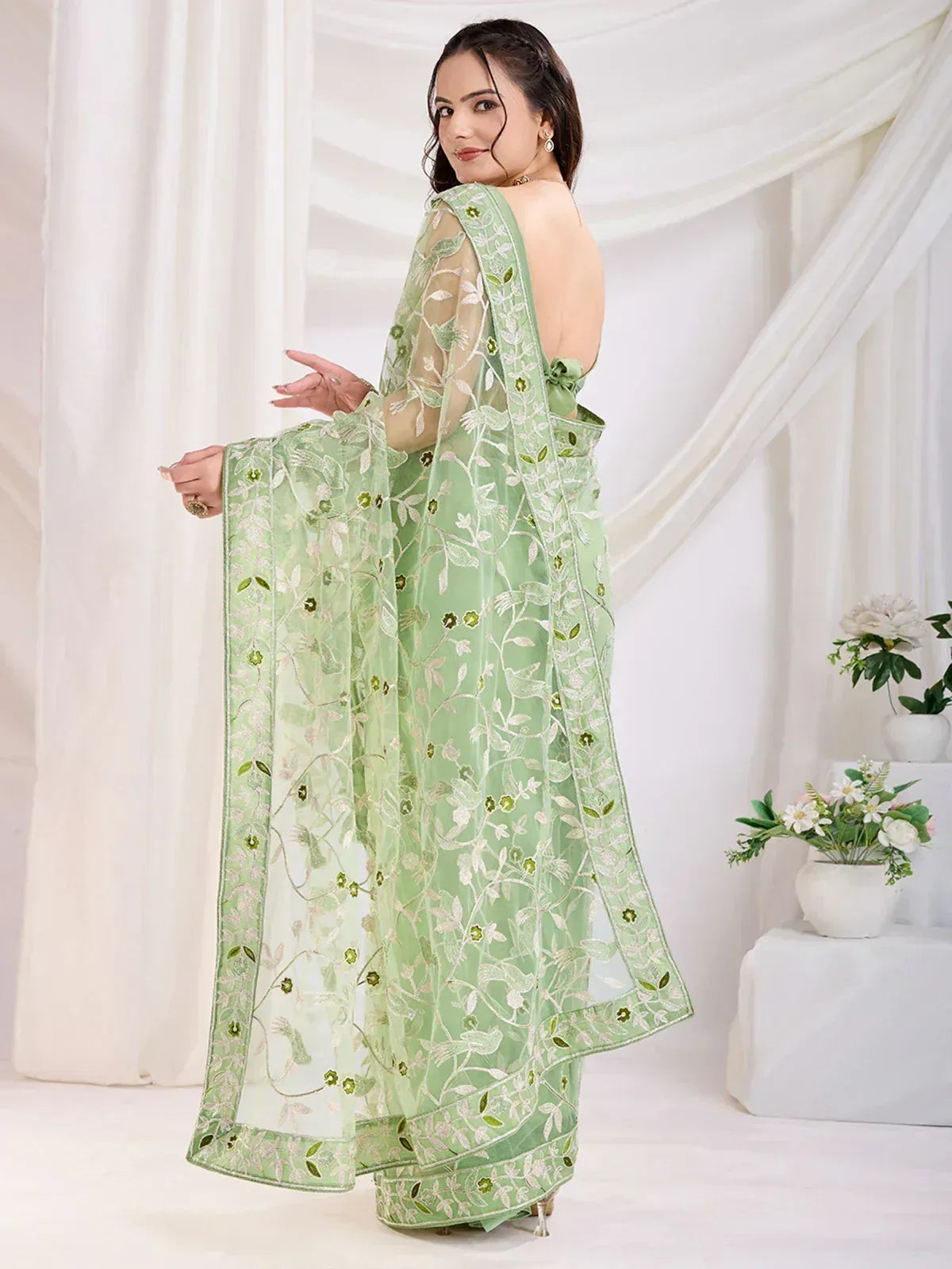 Mint green embroidered saree with floral design, perfect for Indian ethnic occasions