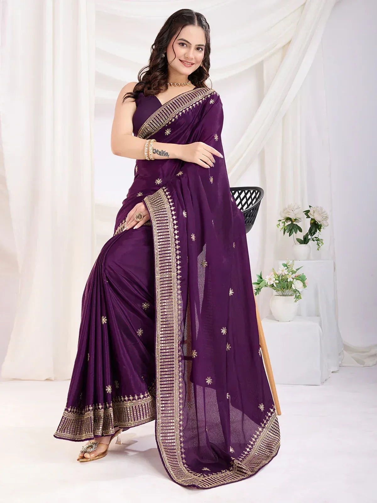 Purple designer saree with gold embroidery, perfect for ethnic occasions and Indian weddings