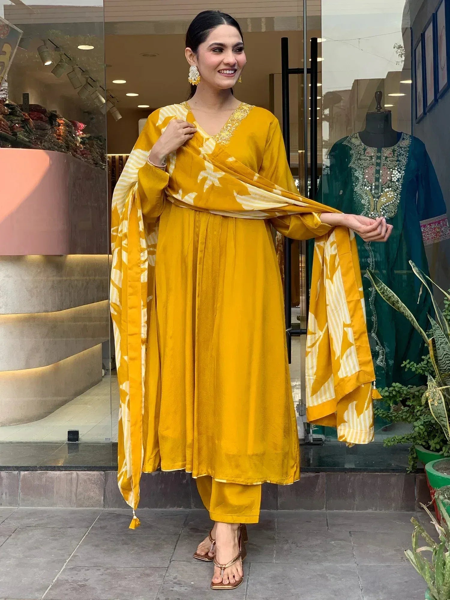 Yellow ethnic salwar kameez with floral dupatta, perfect for Indian festive occasions