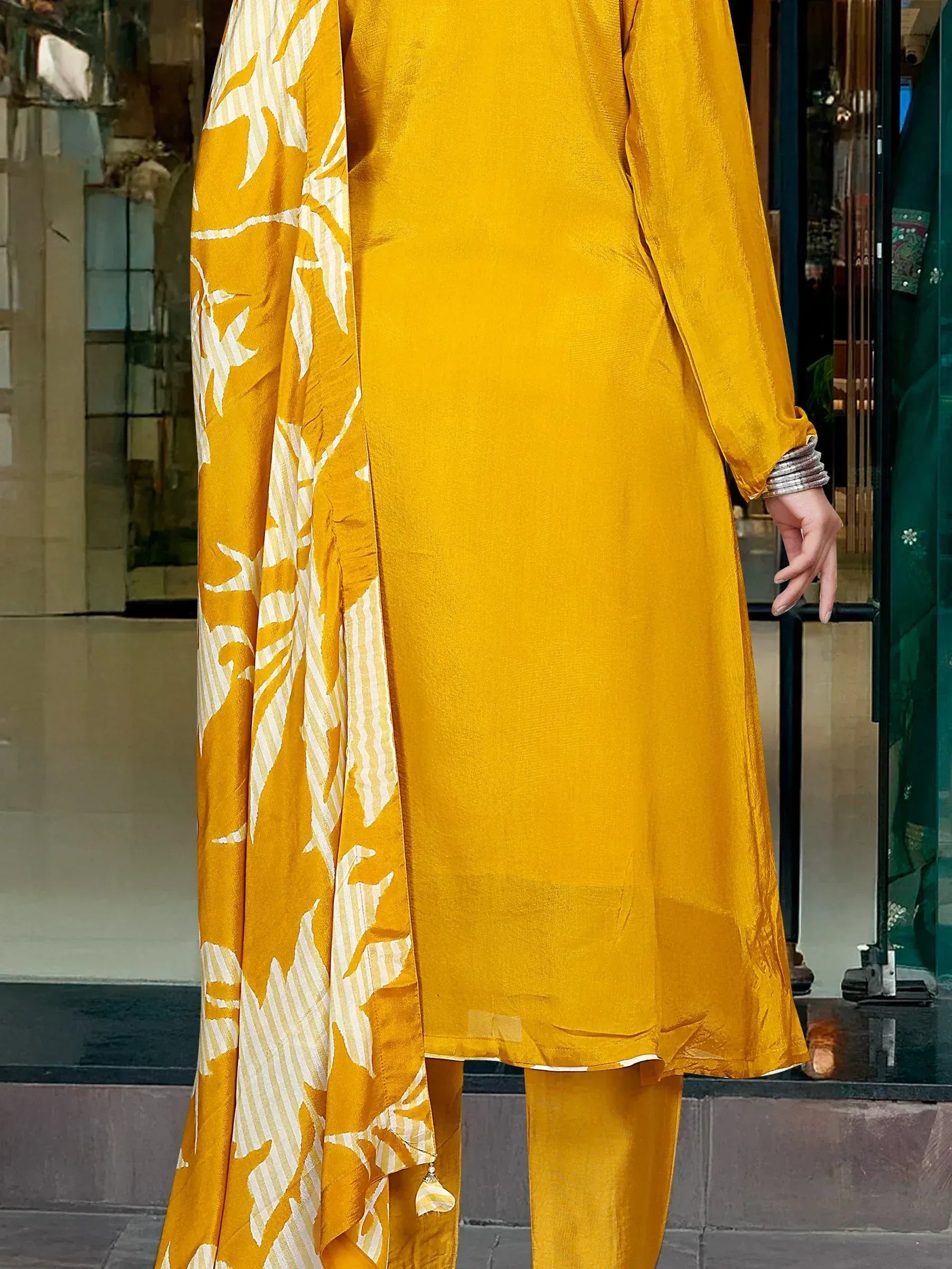 Yellow ethnic salwar kameez with floral dupatta, perfect for festive occasions