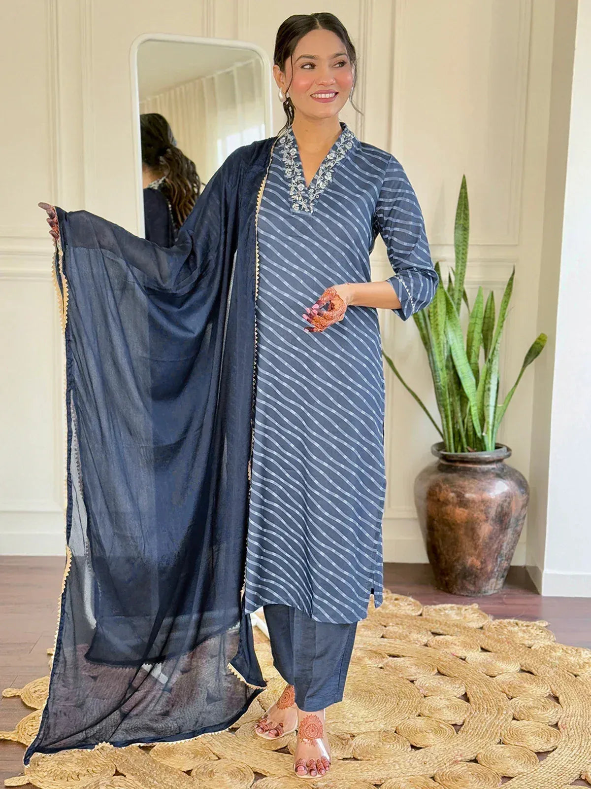 Blue striped salwar kameez with embroidered neckline and sheer dupatta, perfect for ethnic wear