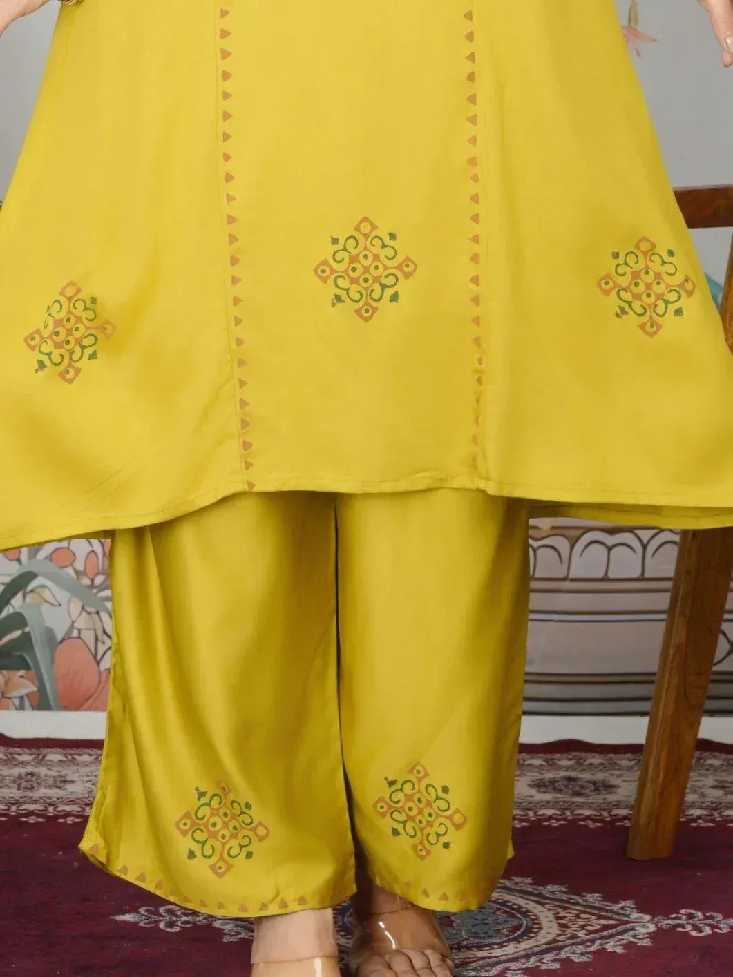 Yellow ethnic kurta with printed motifs and matching palazzo pants, ideal for festive occasions