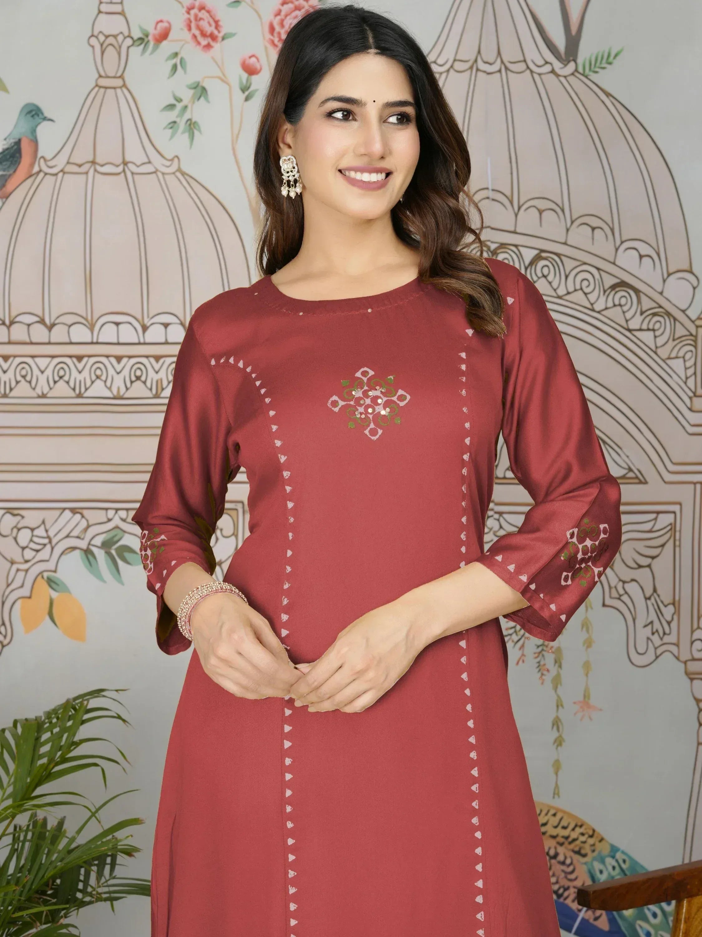 Maroon ethnic kurti with embroidered motifs and mirror work, perfect for Indian festive wear