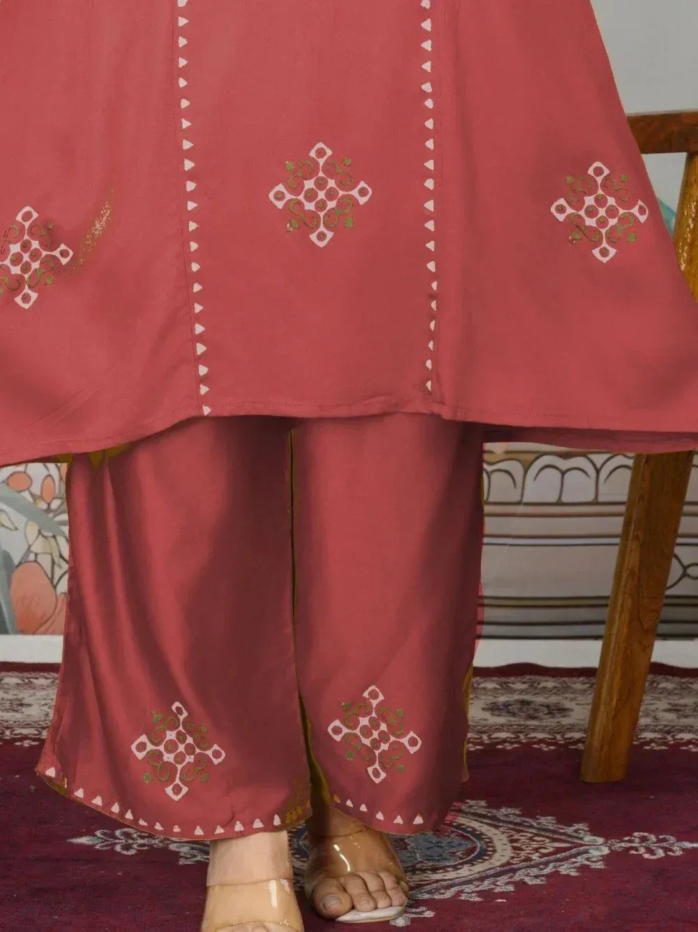 Red ethnic salwar kameez with white and gold geometric embroidery, perfect for Indian wear