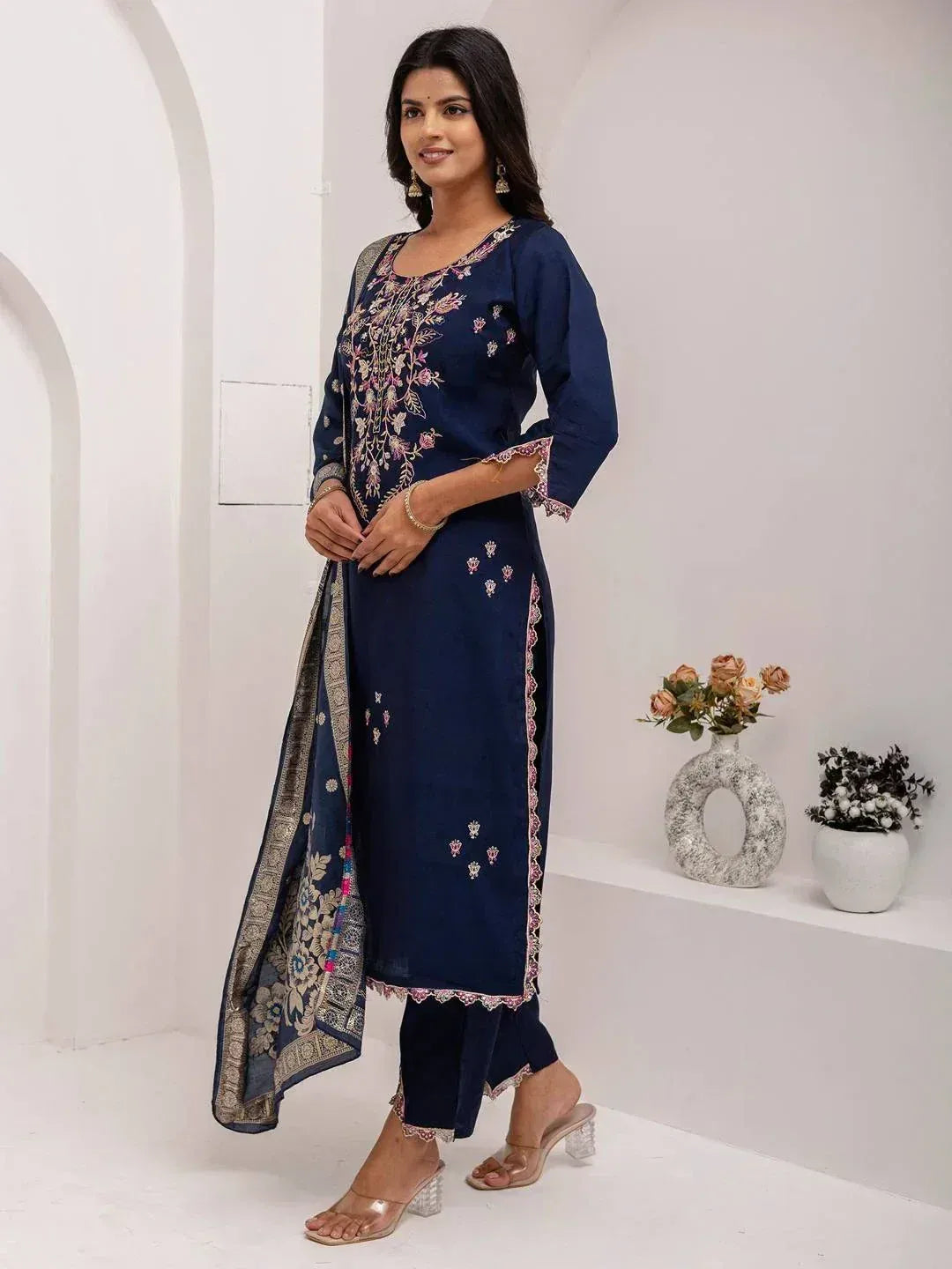 Navy blue embroidered salwar kameez with floral design and matching dupatta, ideal for ethnic occasions