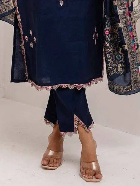 Navy blue embroidered salwar kameez with lace hem and matching dupatta, styled with clear heels