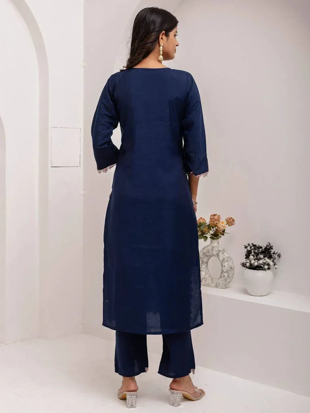 Navy blue ethnic kurta with lace cuffs and matching palazzo pants, back view