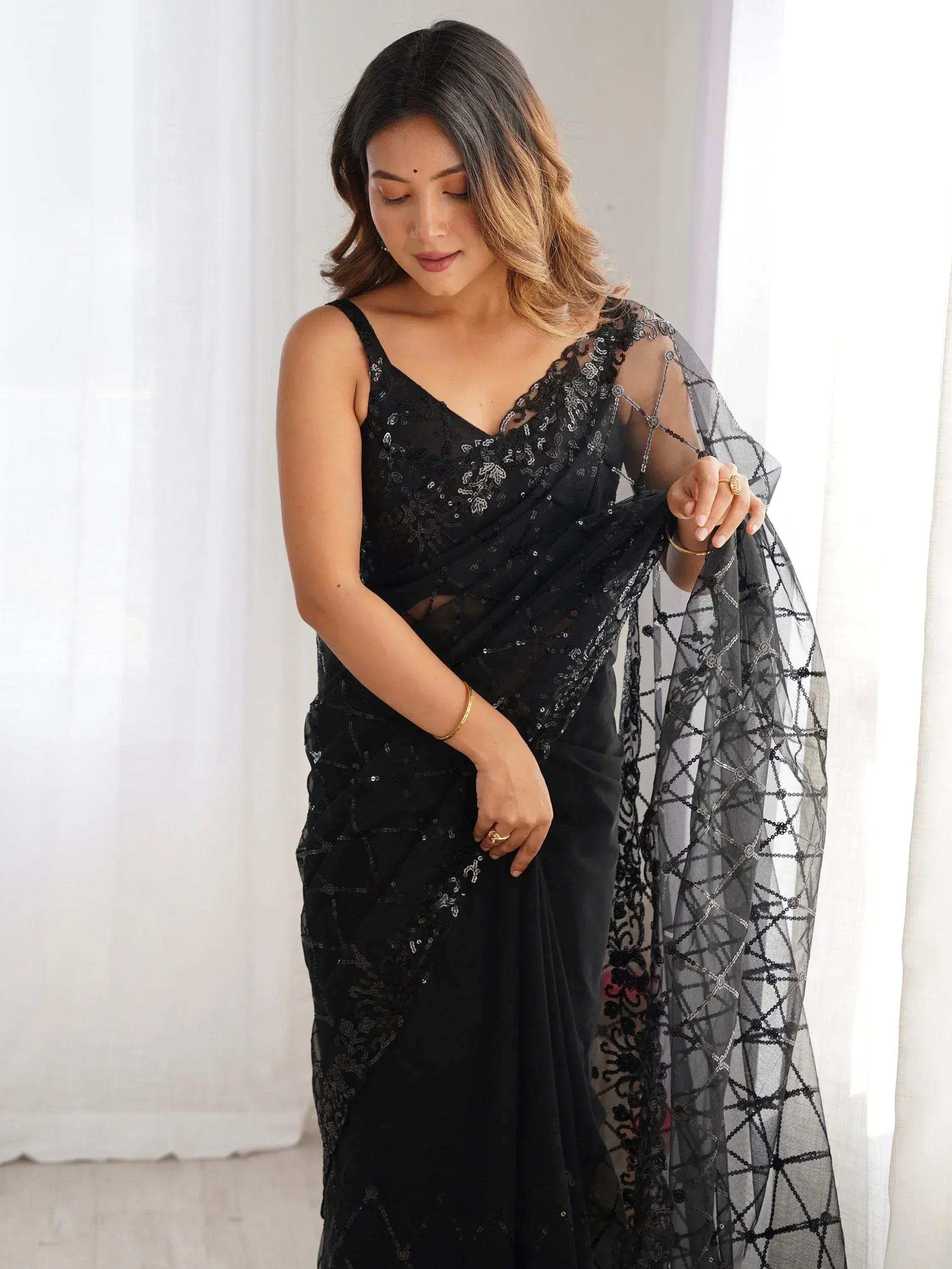 Black sequin saree with sheer net blouse, elegant Indian ethnic wear for women