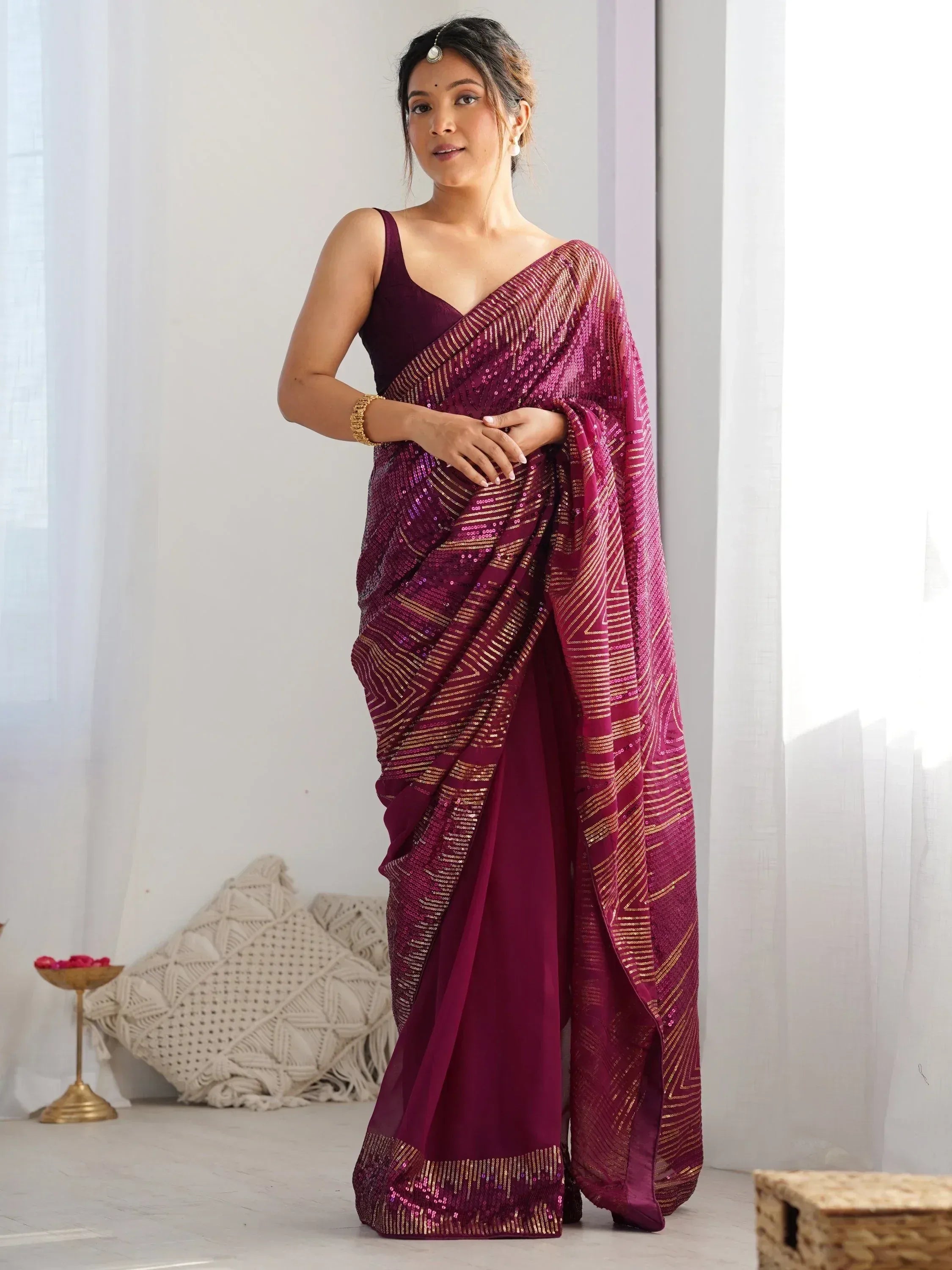 Elegant maroon saree with gold sequin detailing, perfect for Indian ethnic wear occasions