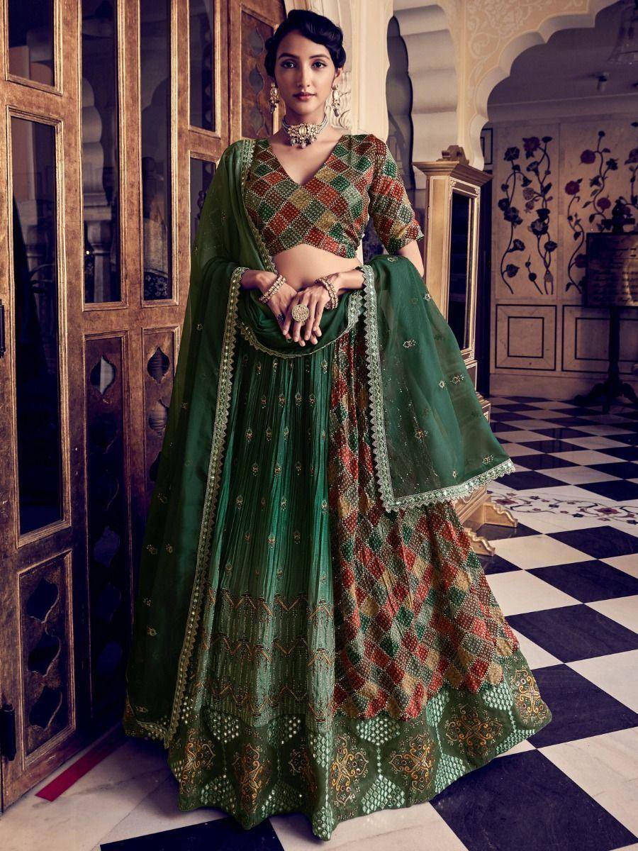 Emerald green designer lehenga choli with geometric embroidery, perfect for Indian weddings and festive occasions.