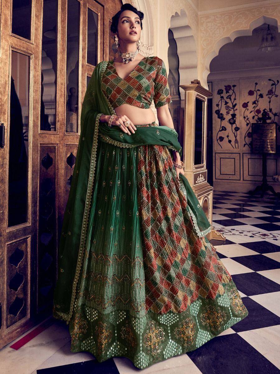 Green and red patterned designer lehenga choli with gold embroidery, perfect for Indian ethnic wear occasions.