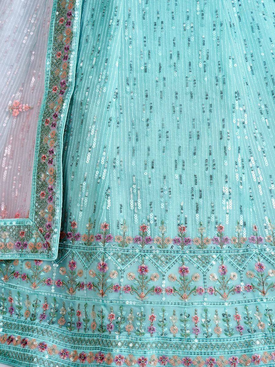 Turquoise sequin lehenga with floral embroidery and matching dupatta, ideal for Indian ethnic wear events.