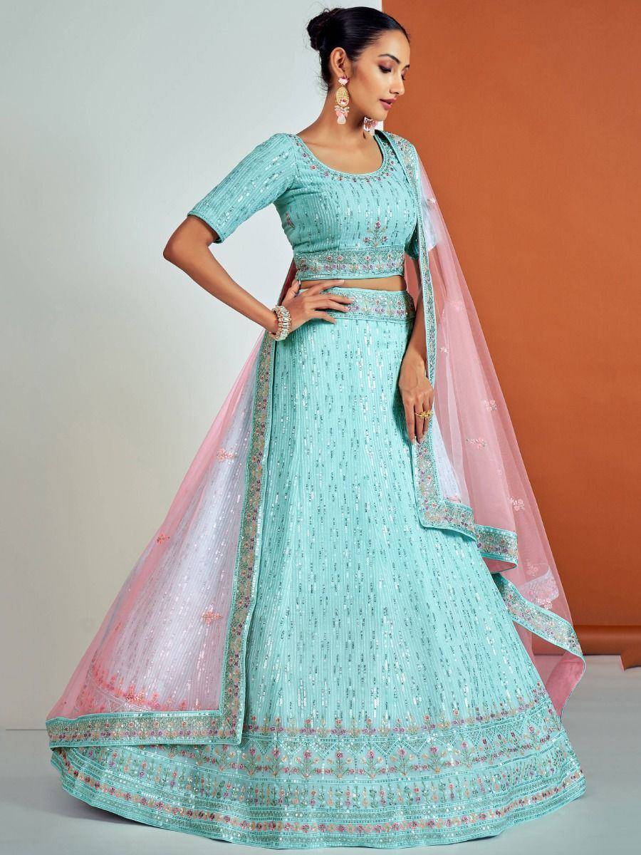 Mint green designer lehenga choli with pink dupatta, perfect for Indian weddings and festive occasions