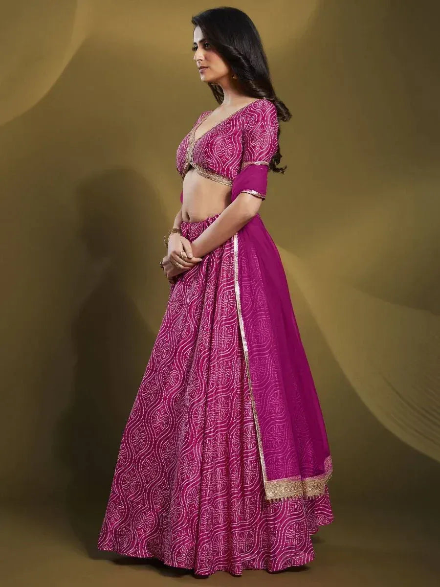 Pink printed lehenga choli with gold trim, ethnic Indian wear for women
