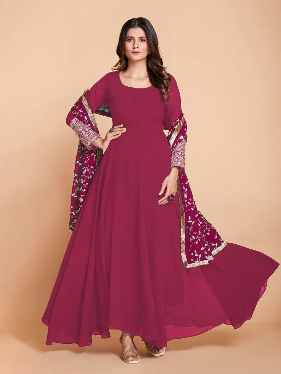 Woman in pink embroidered Anarkali suit with dupatta, Indian ethnic wear fashion