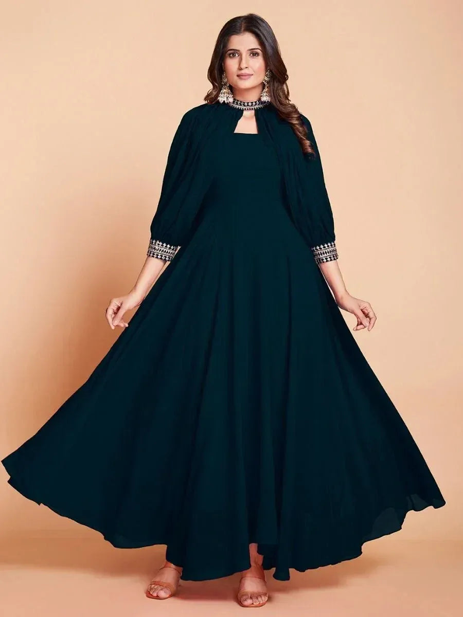 Emerald green ethnic gown with embroidered sleeves, perfect for Indian festive occasions and weddings.