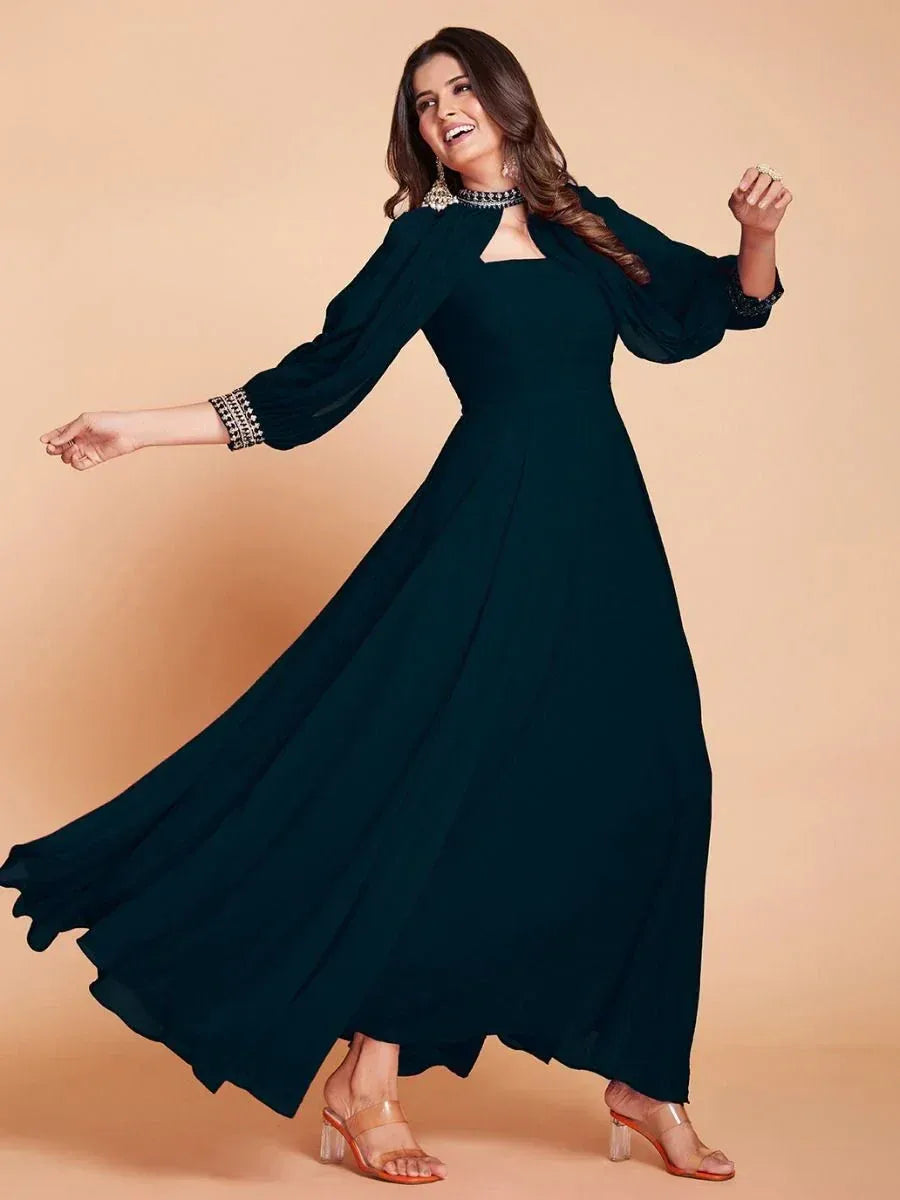 Elegant dark green ethnic gown with embellished sleeves and neckline, perfect for festive occasions.