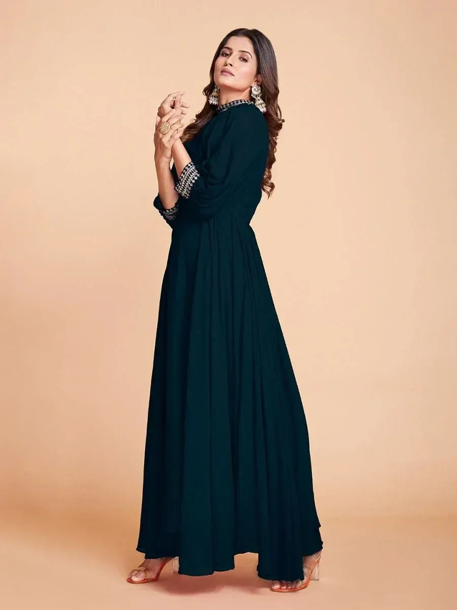Elegant dark green ethnic gown with embellished neckline and sleeves, perfect for Indian occasions