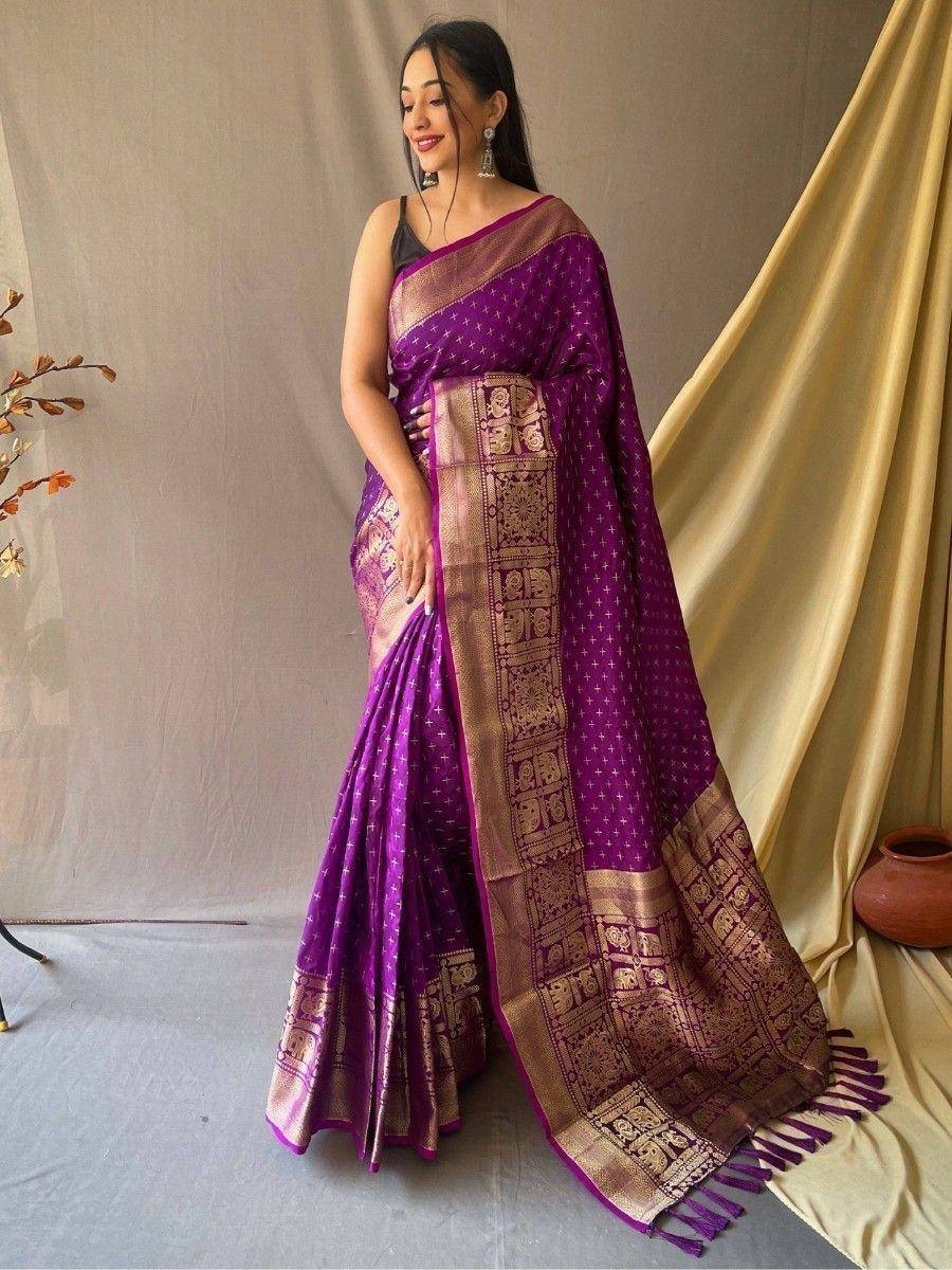 Purple silk saree with gold elephant motifs and temple border, perfect for Indian ethnic occasions