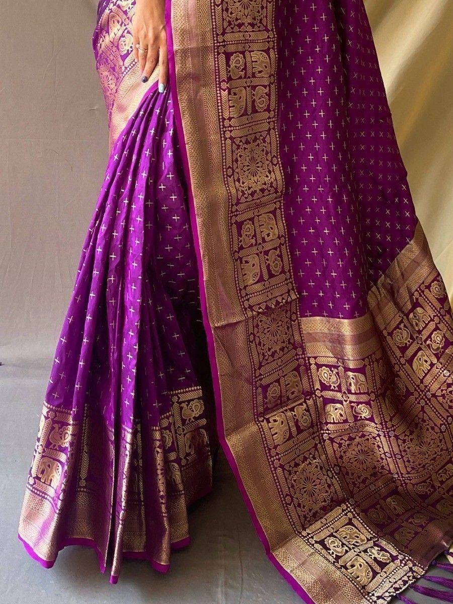 Purple silk saree with gold elephant motifs and temple border, traditional Indian ethnic wear