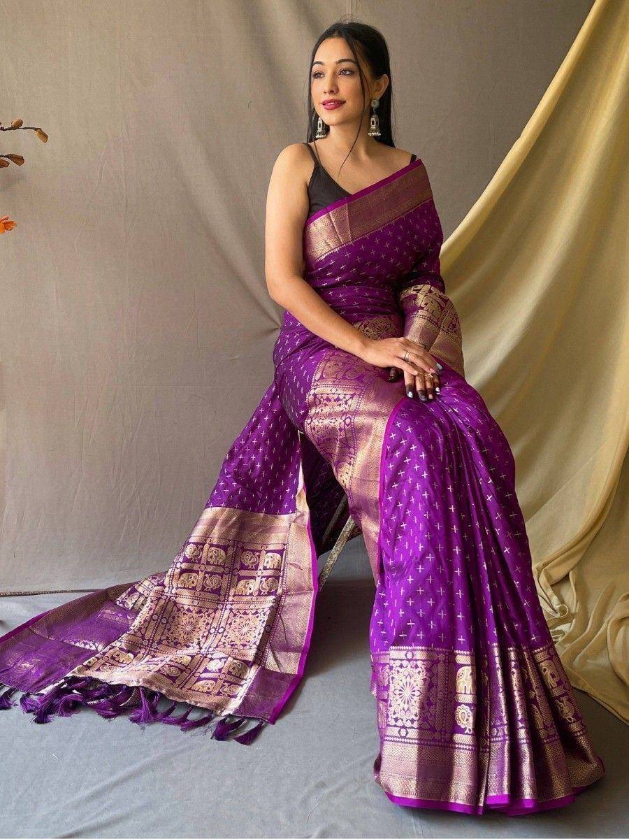 Purple designer saree with gold elephant motifs and border, perfect for Indian ethnic wear occasions