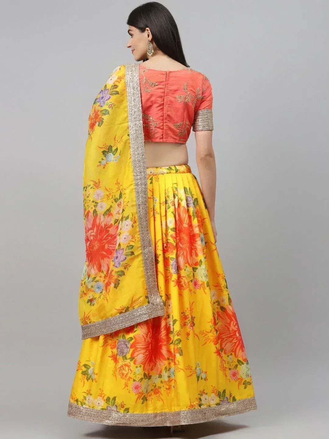 Yellow floral lehenga choli with peach blouse and silver border, ethnic Indian wear