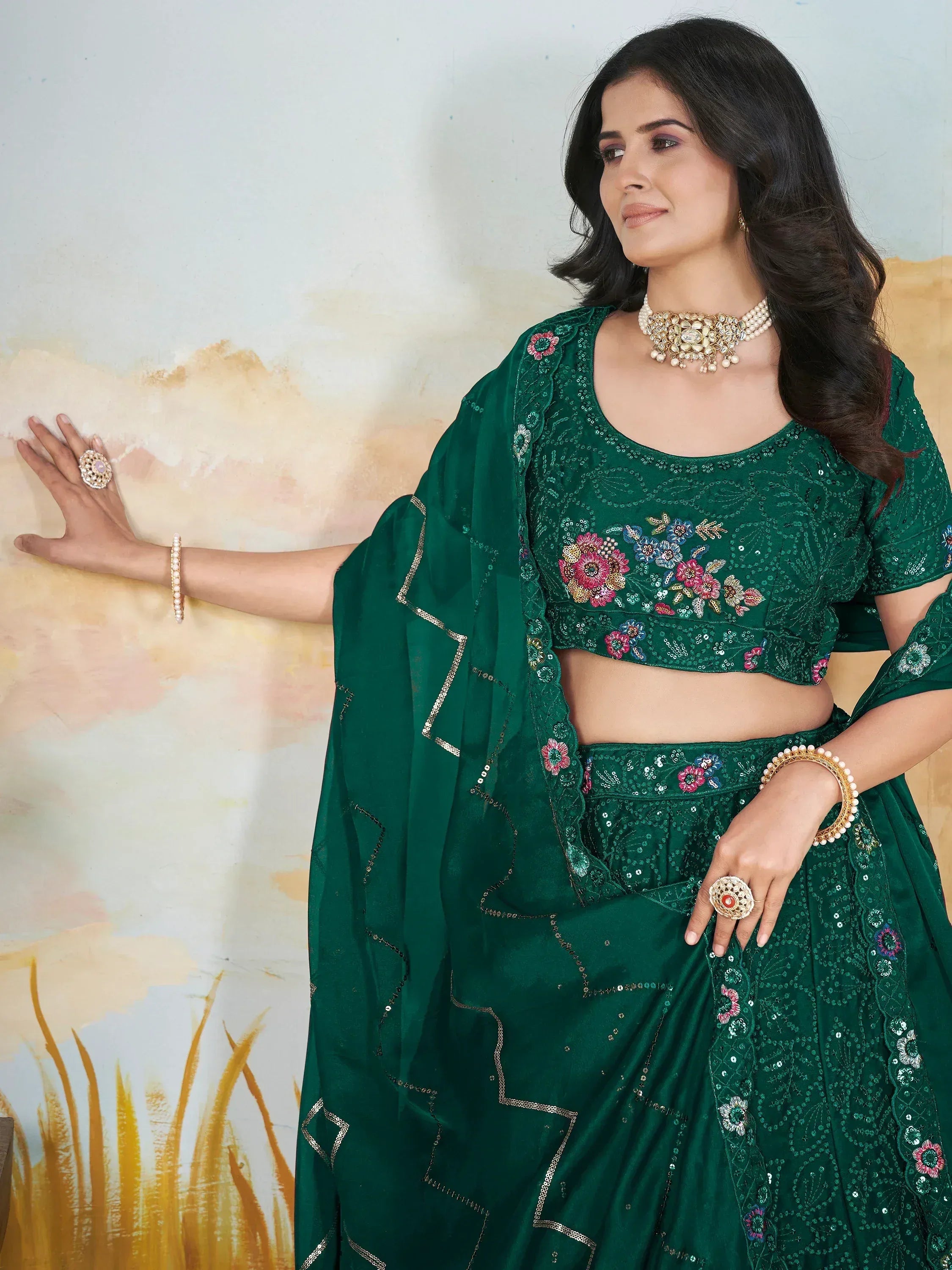 Emerald green embroidered lehenga choli with floral sequin work, perfect for Indian ethnic wear occasions.